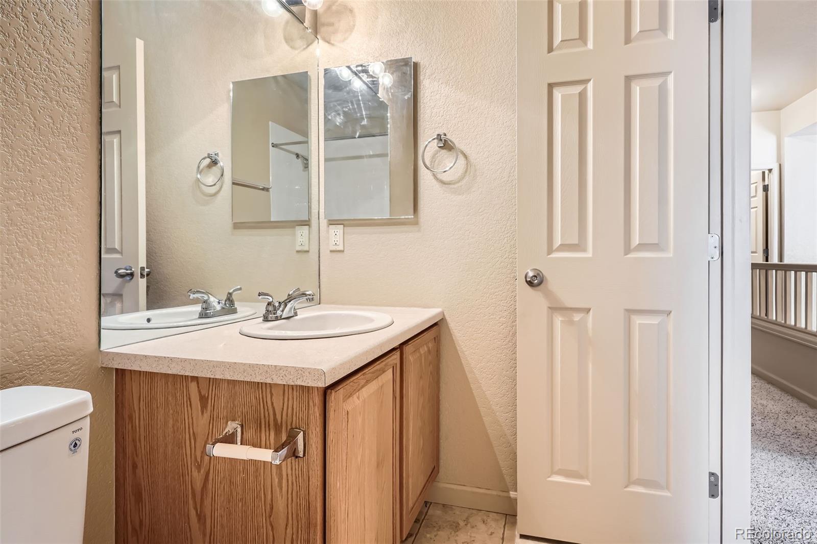 1978 Granger Circle Castle Rock, CO 80109 - Photo 24 of 31 a bathroom with a sink and a mirror