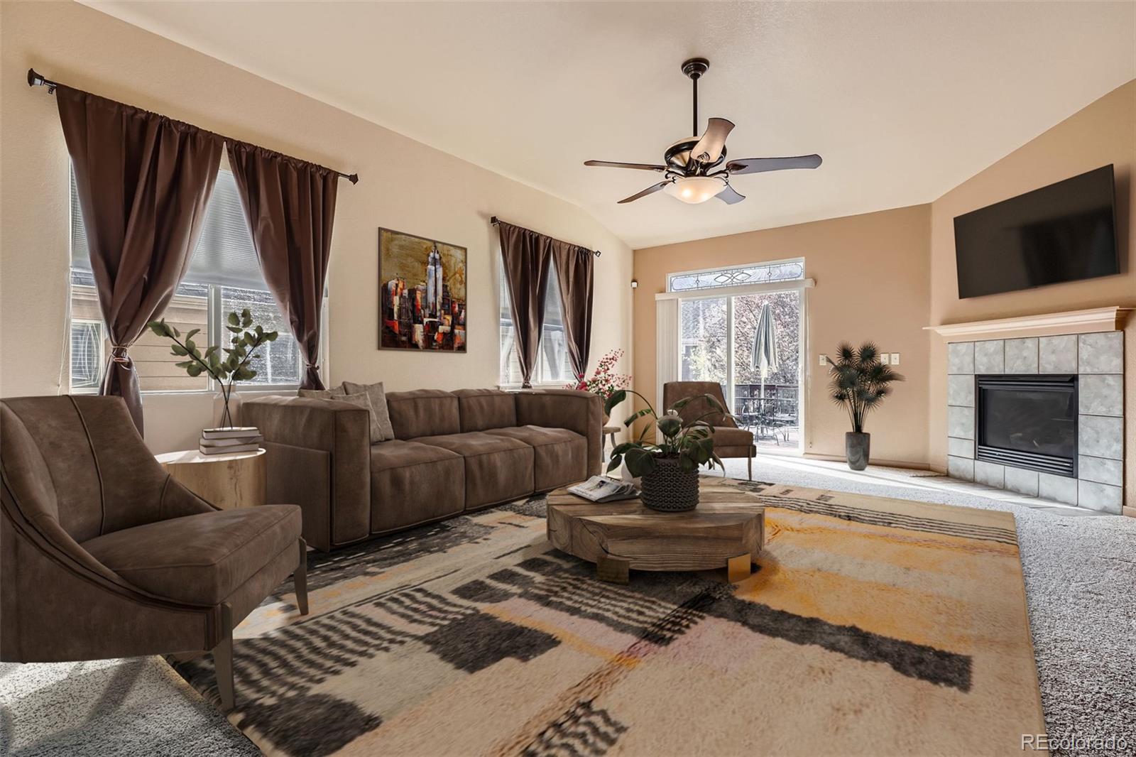 1978 Granger Circle Castle Rock, CO 80109 - Photo 5 of 31 a living room with fireplace furniture and a flat screen tv