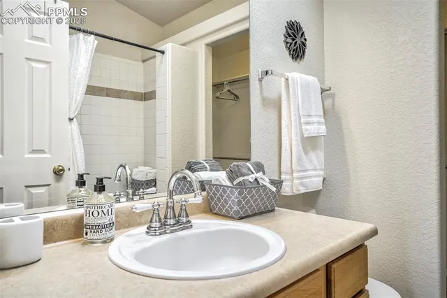 a dining room with furniture and a window