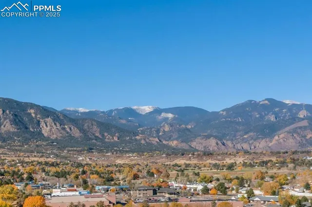 a view of a city with mountains in the background