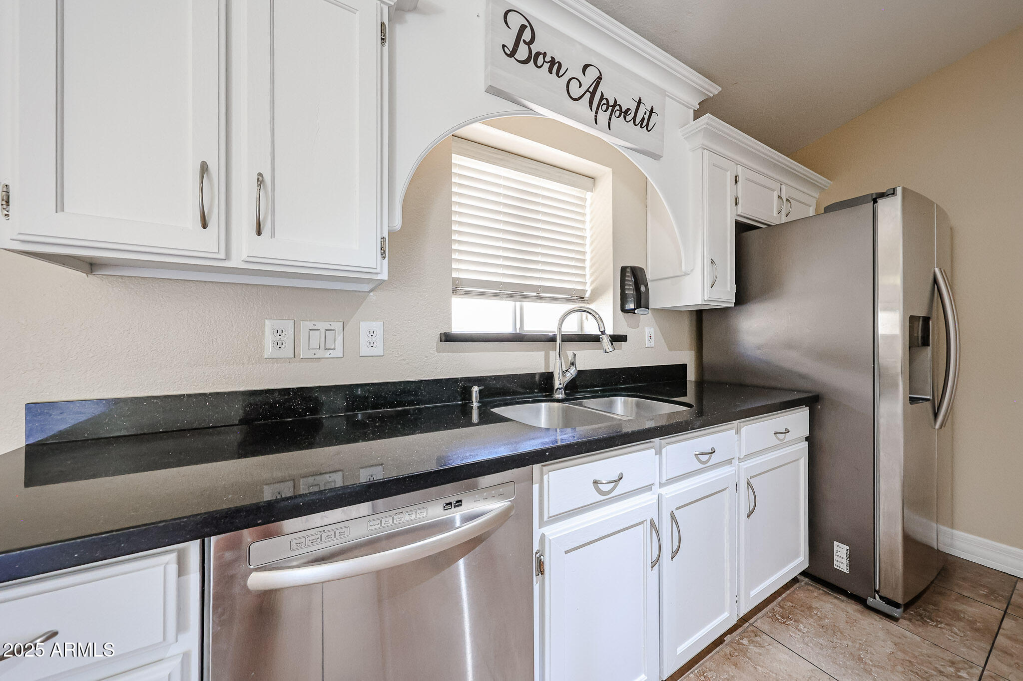 3897 East Douglas Loop Gilbert, AZ 85234 - Photo 11 of 34 a kitchen with granite countertop white cabinets and a sink