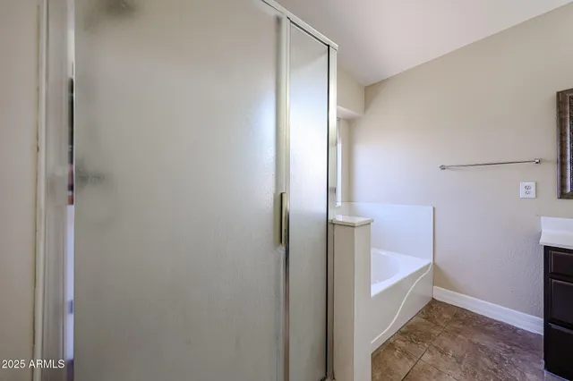 a bathroom with a double vanity sink and mirror