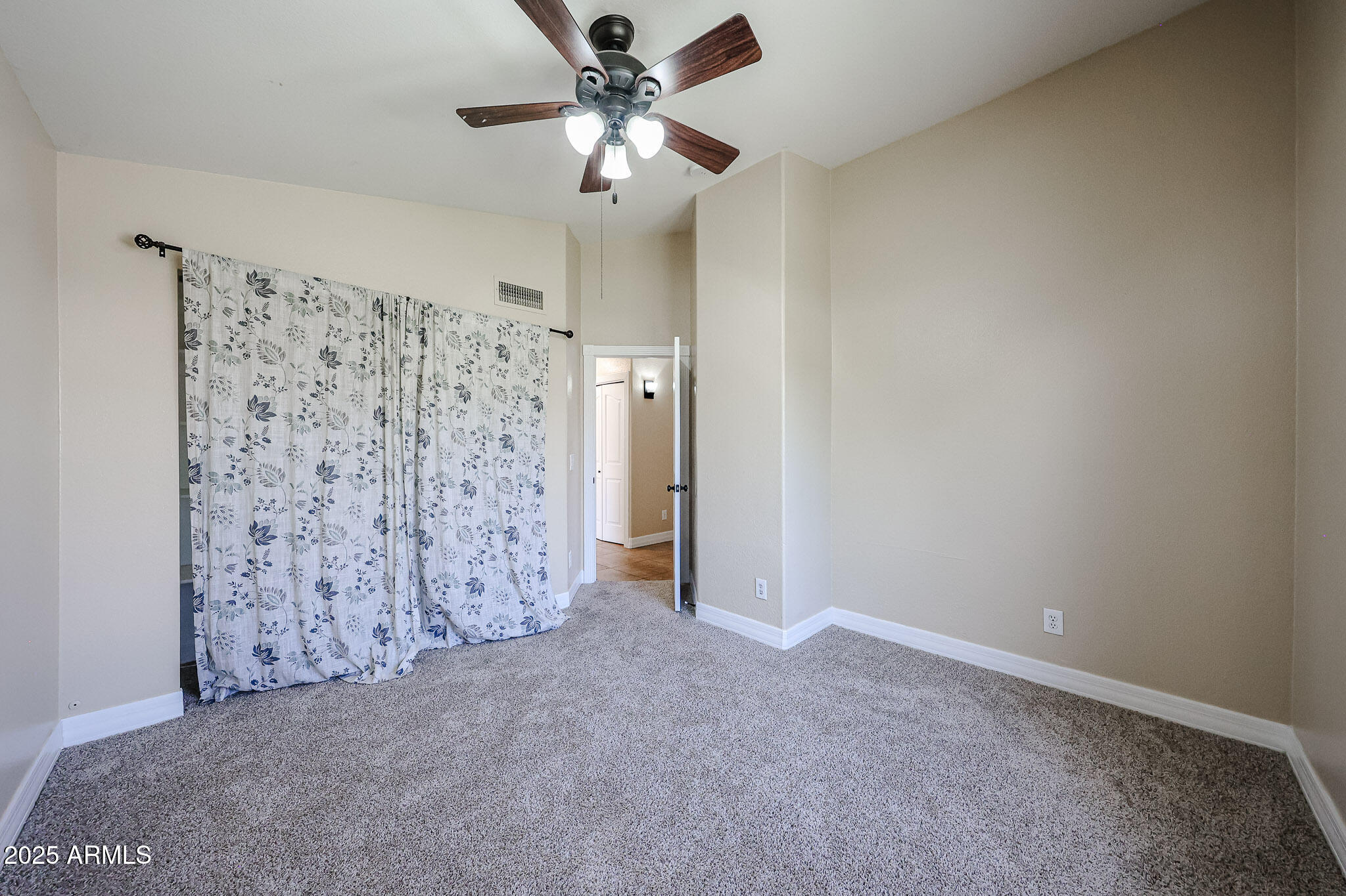 3897 East Douglas Loop Gilbert, AZ 85234 - Photo 24 of 34 a view of a big room with closet and a chandelier fan