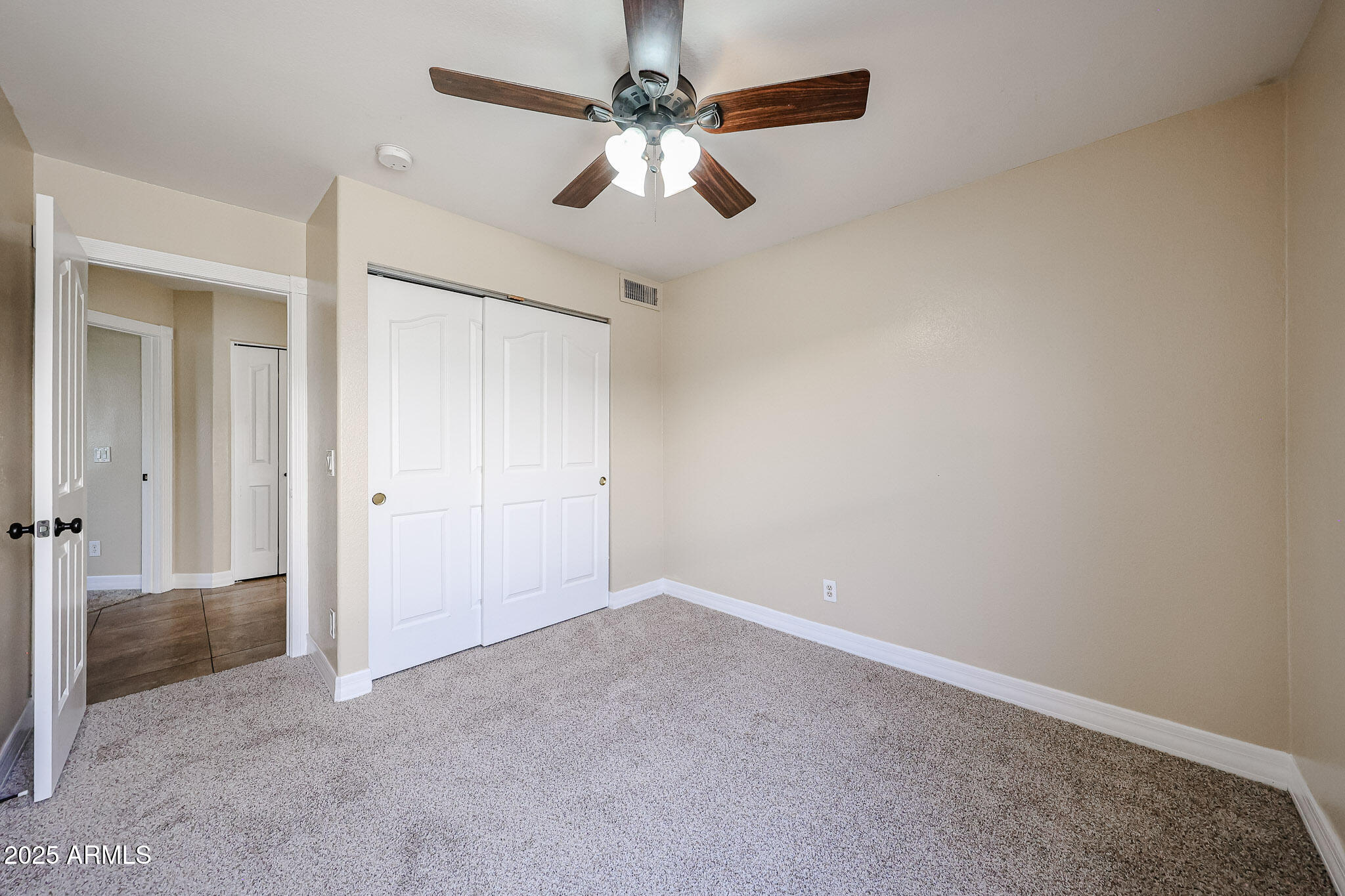 3897 East Douglas Loop Gilbert, AZ 85234 - Photo 26 of 34 an empty room with chandelier fan
