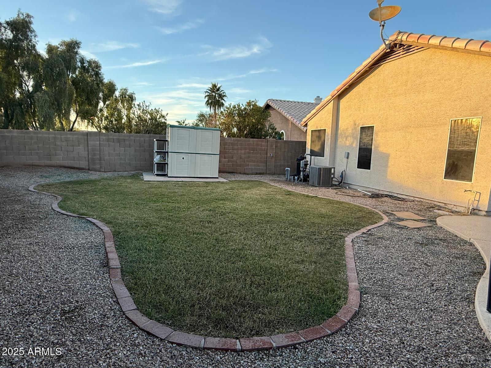 3897 East Douglas Loop Gilbert, AZ 85234 - Photo 34 of 34 a view of a house with a backyard