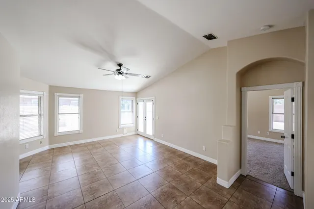 a view of an empty room with glass door