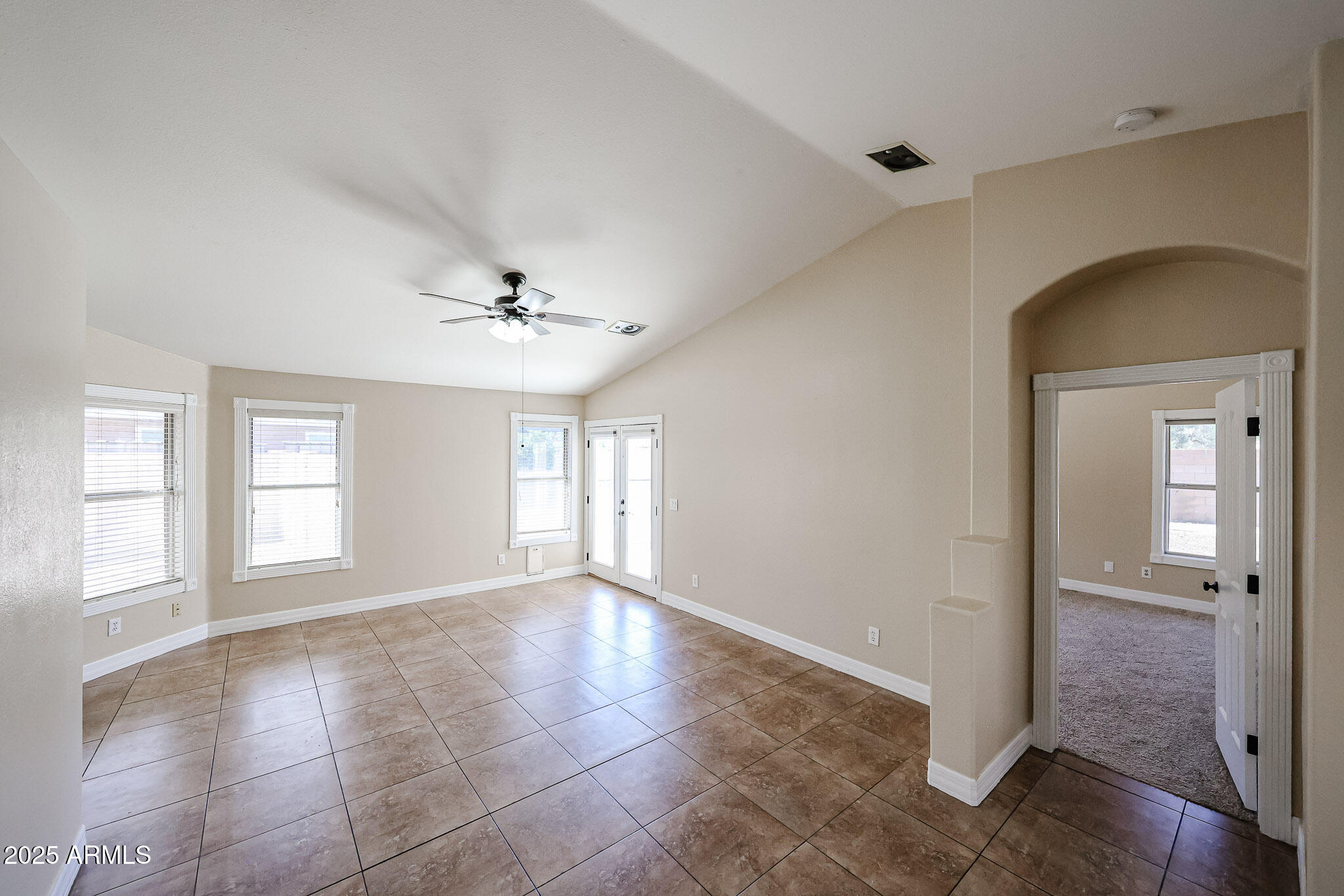 3897 East Douglas Loop Gilbert, AZ 85234 - Photo 5 of 34 a view of an empty room with glass door