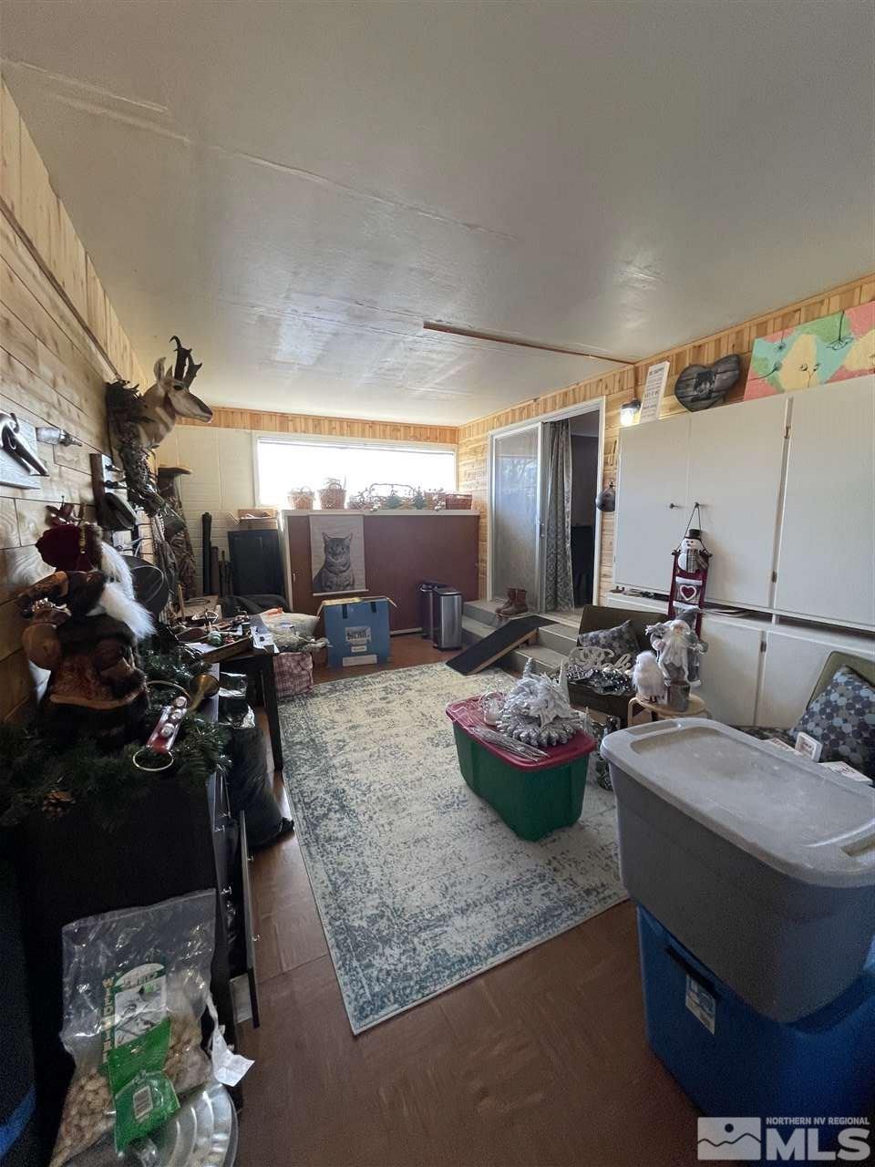 2195 Arcane Avenue Reno, NV 89503 - Photo 8 of 19 a living room with furniture and a chandelier