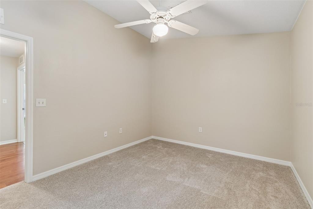4631 Eagle Ranch Drive Zephyrhills, FL 33542 - Photo 22 of 58 an empty room with a fan & a window