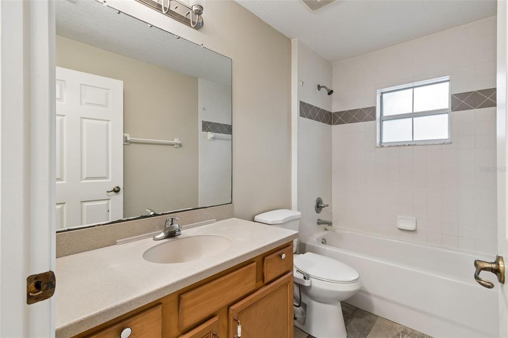 4631 Eagle Ranch Drive Zephyrhills, FL 33542 - Photo 28 of 58 a bathroom with a sink toilet tub and shower