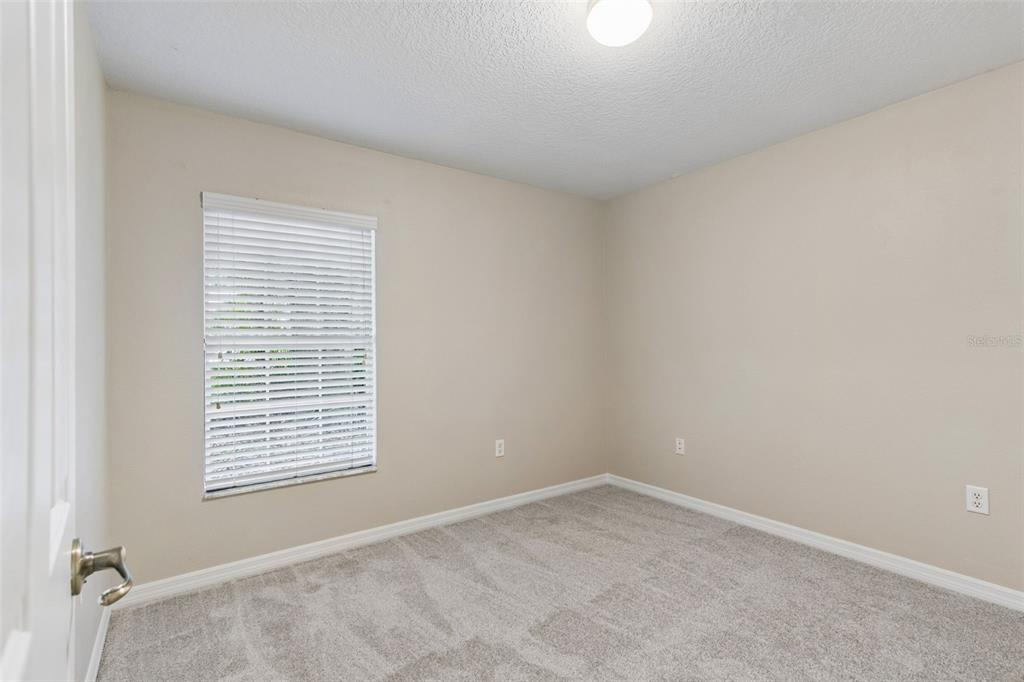 4631 Eagle Ranch Drive Zephyrhills, FL 33542 - Photo 29 of 58 an empty room with a window