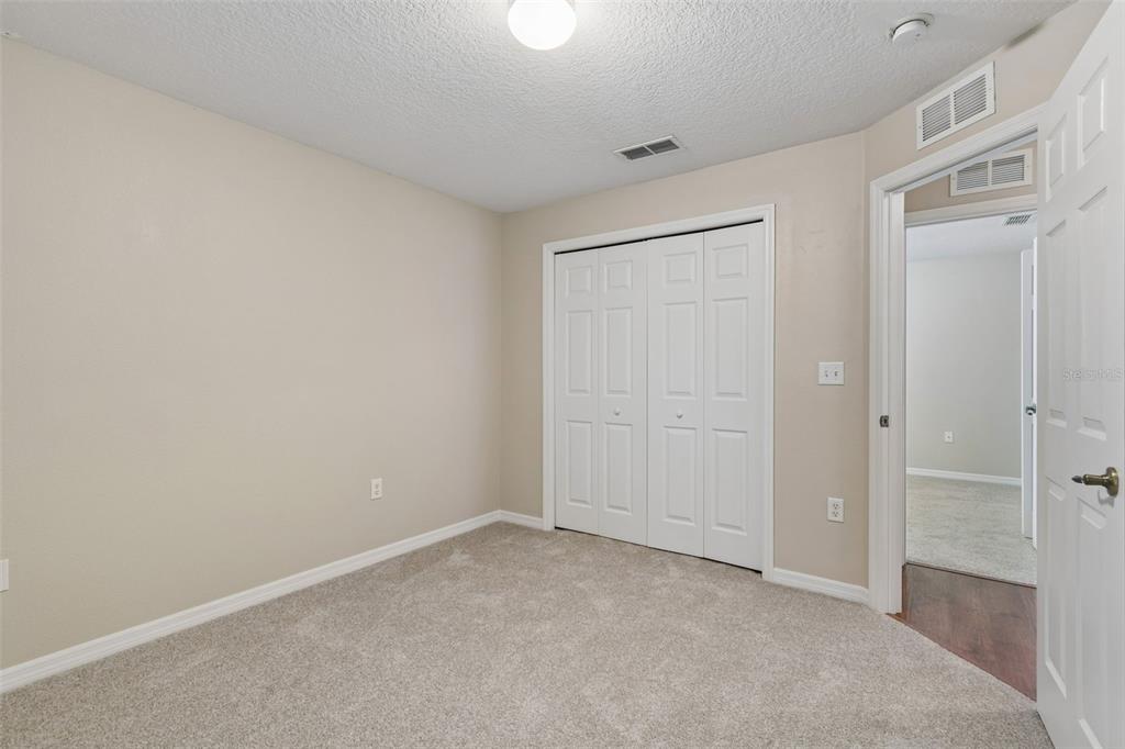 4631 Eagle Ranch Drive Zephyrhills, FL 33542 - Photo 30 of 58 an empty room with closet area