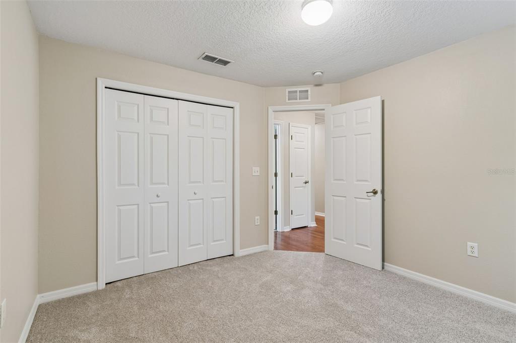 4631 Eagle Ranch Drive Zephyrhills, FL 33542 - Photo 31 of 58 an empty room with closet area