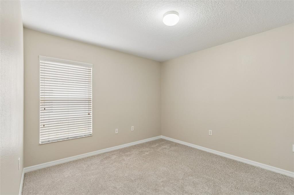 4631 Eagle Ranch Drive Zephyrhills, FL 33542 - Photo 33 of 58 an empty room with a window