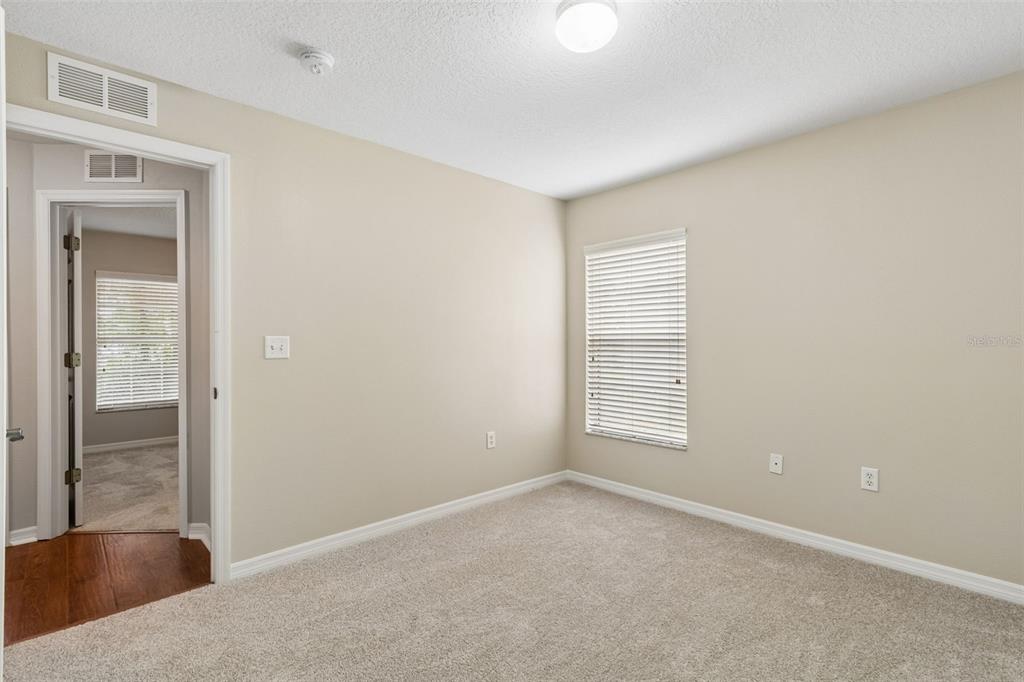 4631 Eagle Ranch Drive Zephyrhills, FL 33542 - Photo 36 of 58 an empty room with windows