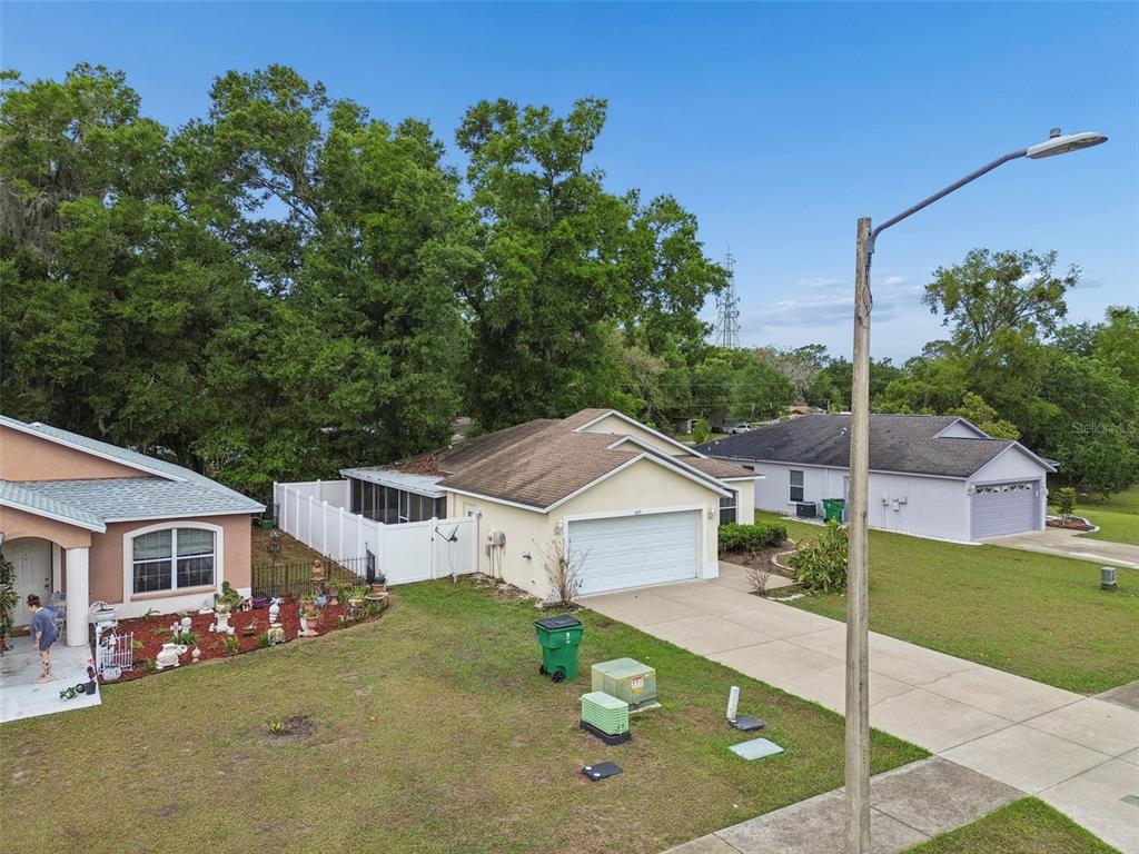 4631 Eagle Ranch Drive Zephyrhills, FL 33542 - Photo 44 of 58 a view of a house with a backyard