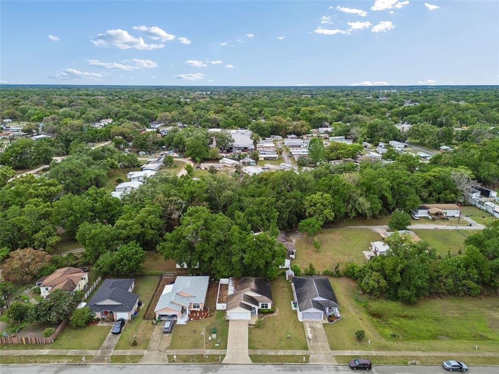 4631 Eagle Ranch Drive Zephyrhills, FL 33542 - Photo 49 of 58 a view of a lake with houses