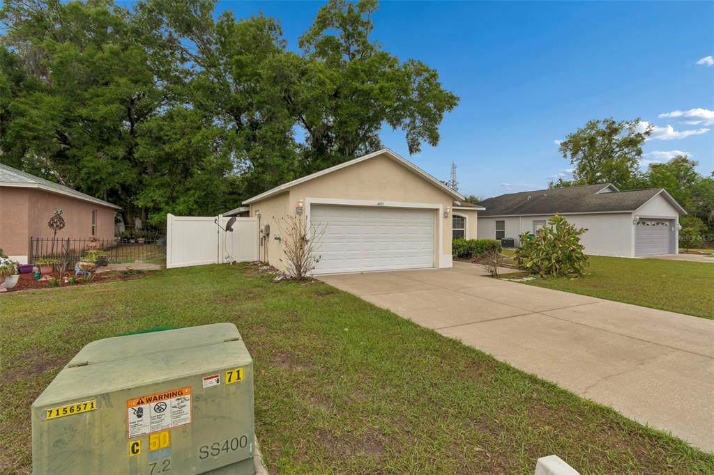 4631 Eagle Ranch Drive Zephyrhills, FL 33542 - Photo 5 of 58 a house view with a garden space