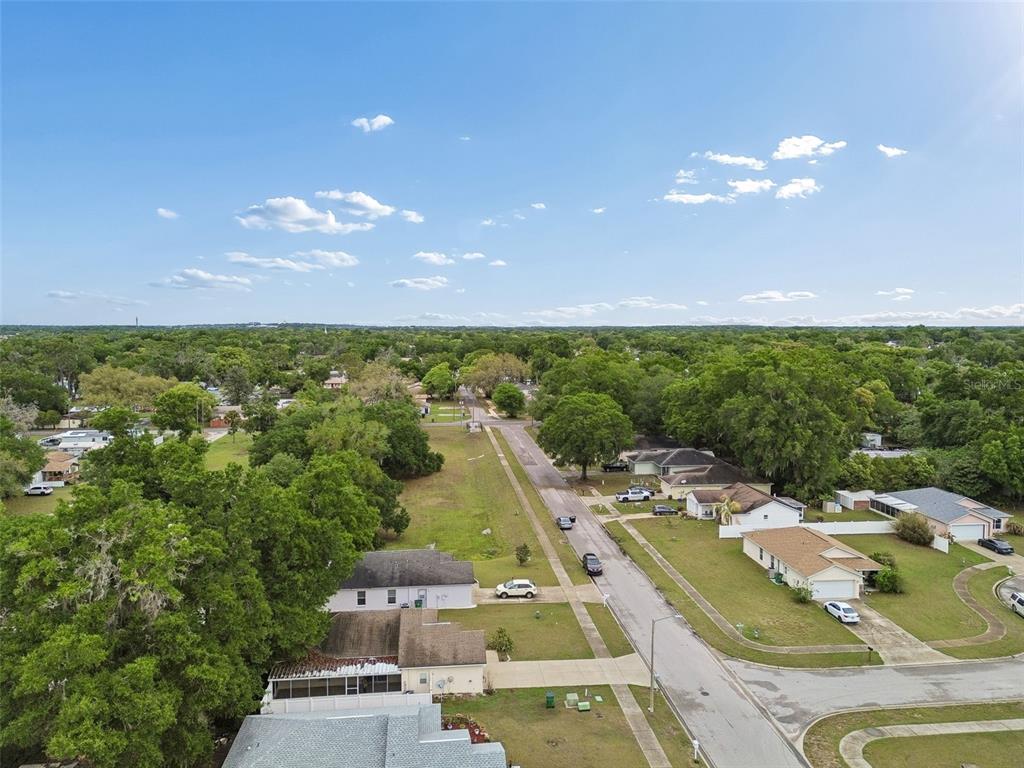 4631 Eagle Ranch Drive Zephyrhills, FL 33542 - Photo 57 of 58 an aerial view of residential houses with outdoor space and swimming pool
