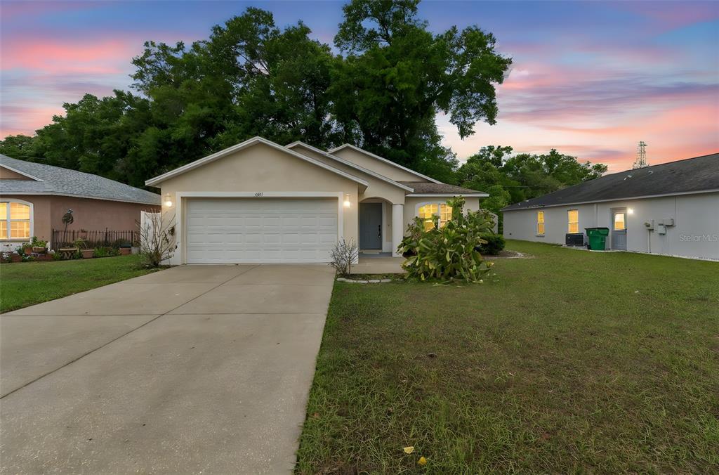 4631 Eagle Ranch Drive Zephyrhills, FL 33542 - Photo 58 of 58 a front view of a house with garden