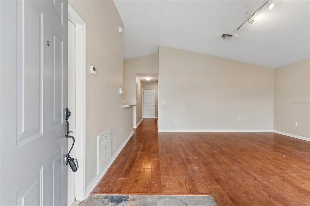 4631 Eagle Ranch Drive Zephyrhills, FL 33542 - Photo 8 of 58 a view of hallway with wooden floor