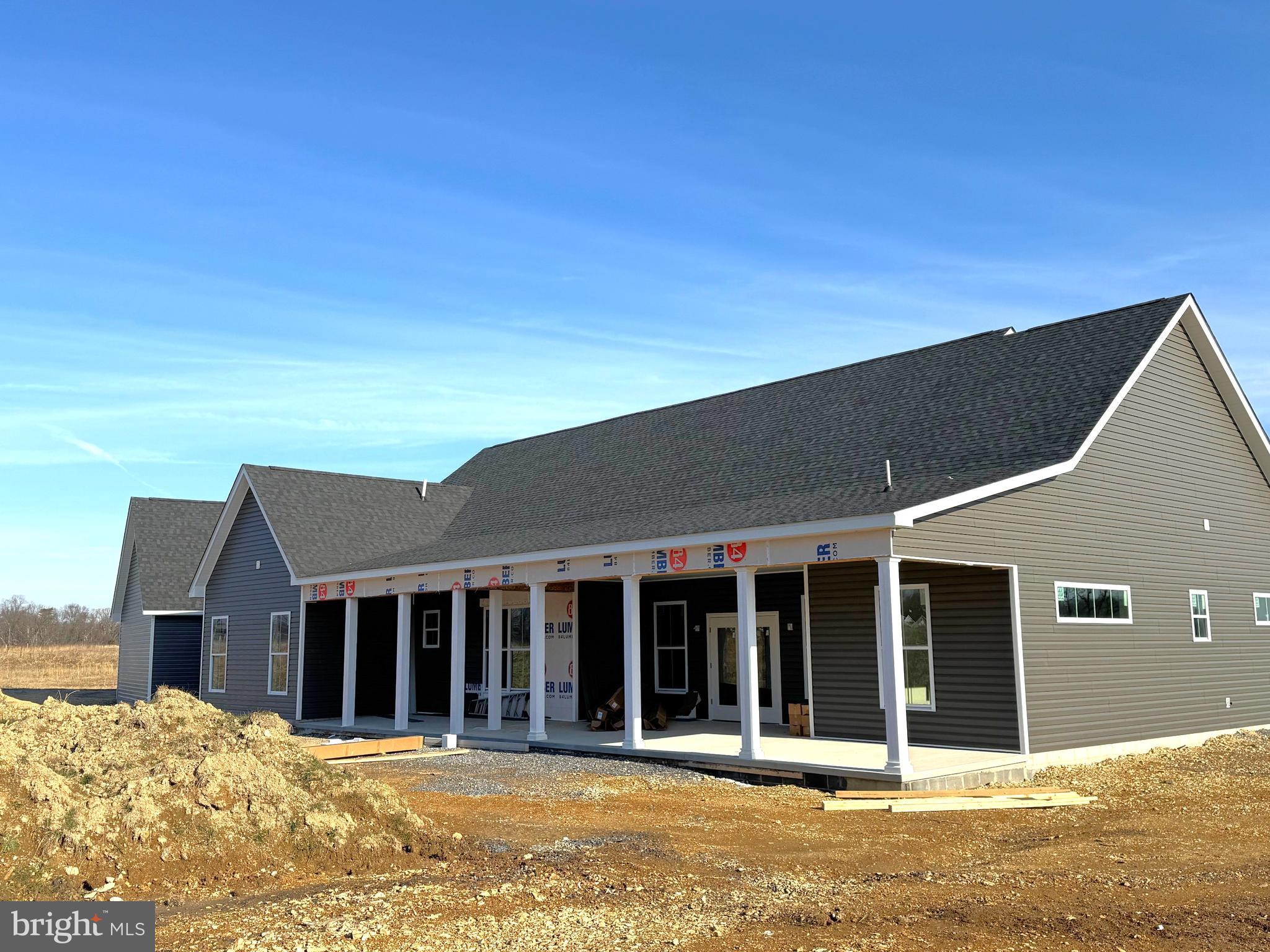 58 Dibble Road Bunker Hill, WV 25413 - Photo 7 of 58 Rear w/ 54ft covered porch, partially screened
