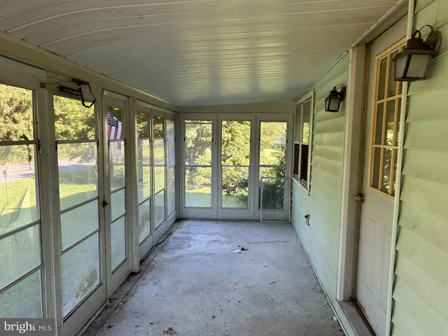 a view of hallway with windows