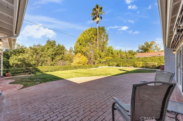 a view of a swimming pool with a yard