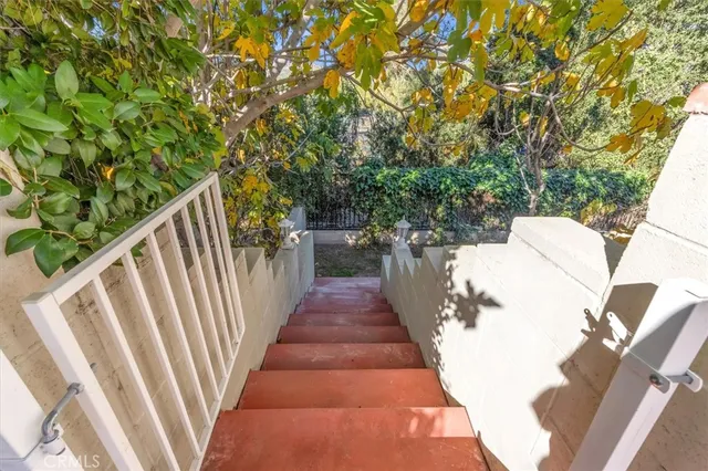 a view of a balcony with wooden floor