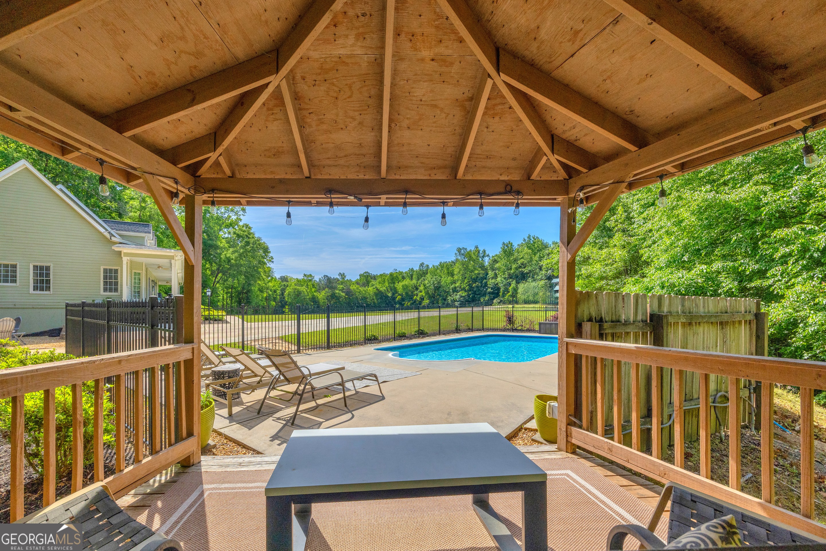 533 Emory Chambers Road Lula, GA 30554 - Photo 16 of 88 a view of a swimming pool with a patio