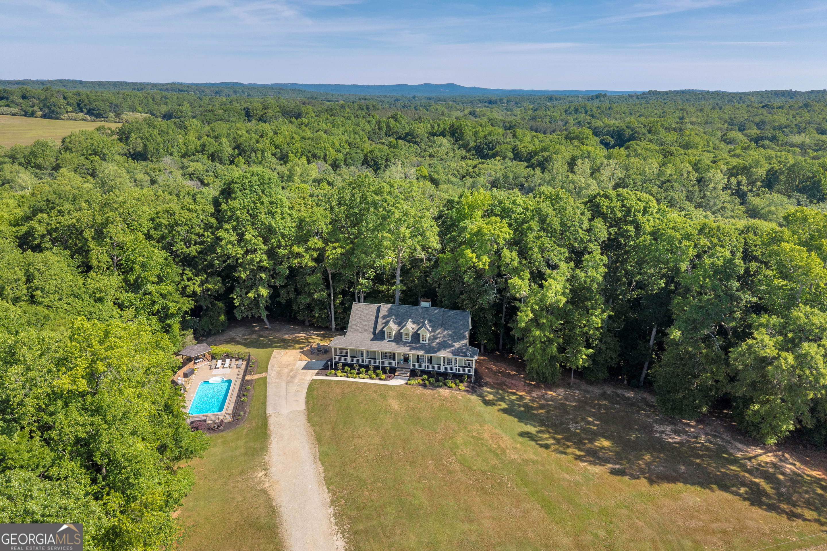 533 Emory Chambers Road Lula, GA 30554 - Photo 2 of 88 a view of a swimming pool with a yard