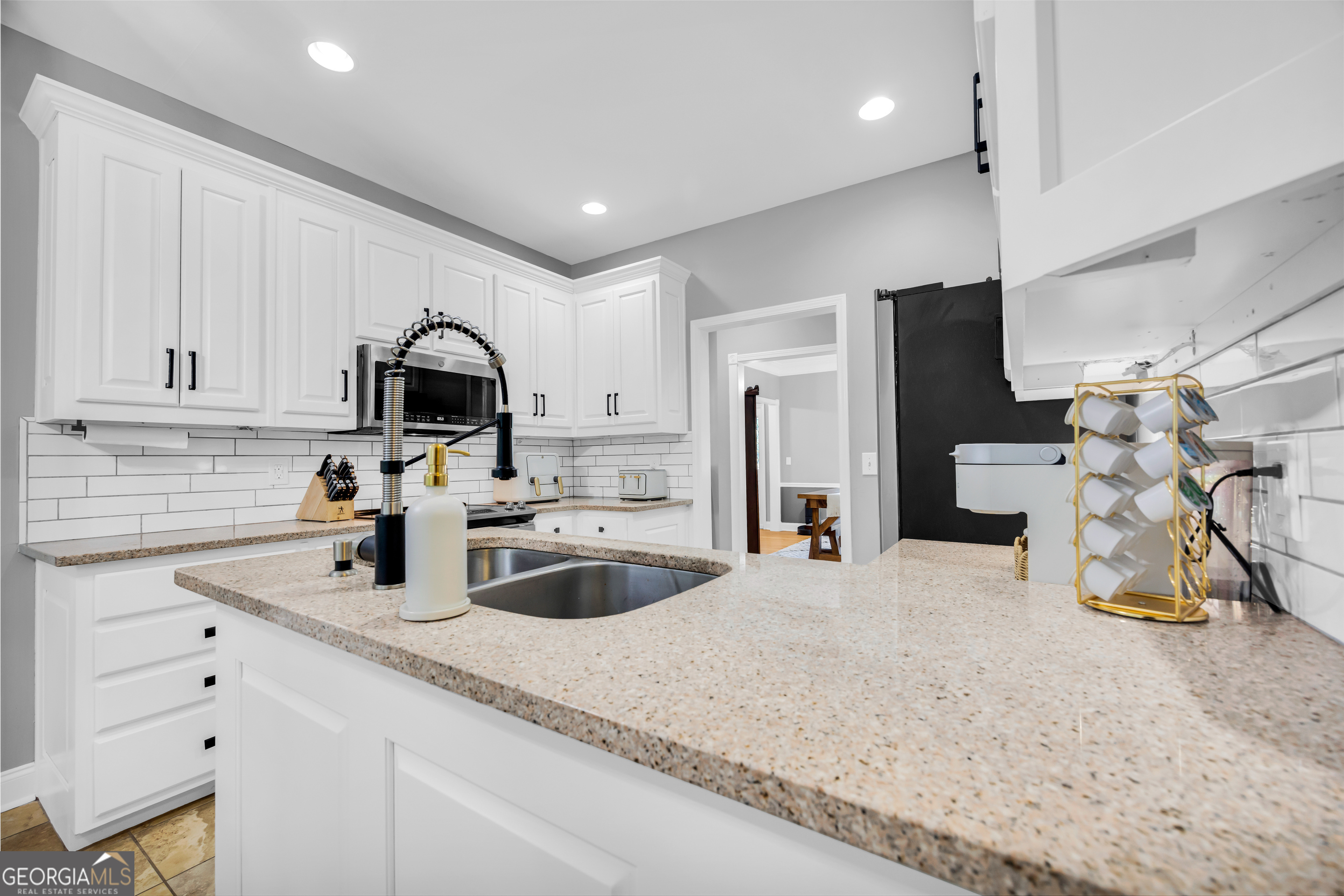 533 Emory Chambers Road Lula, GA 30554 - Photo 27 of 88 a kitchen with stainless steel appliances a sink a stove and refrigerator