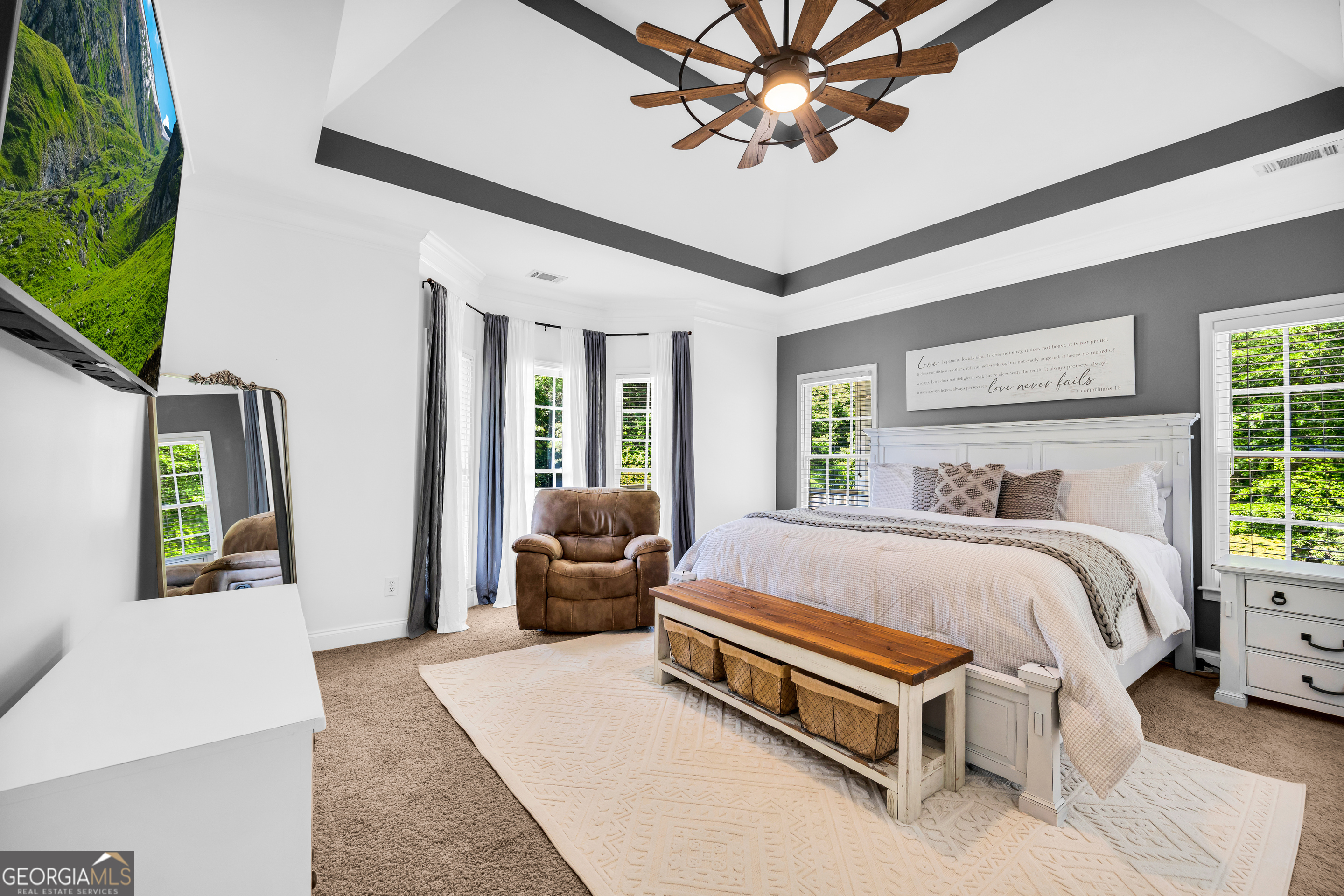 533 Emory Chambers Road Lula, GA 30554 - Photo 36 of 88 a bed room with a bed and a chandelier