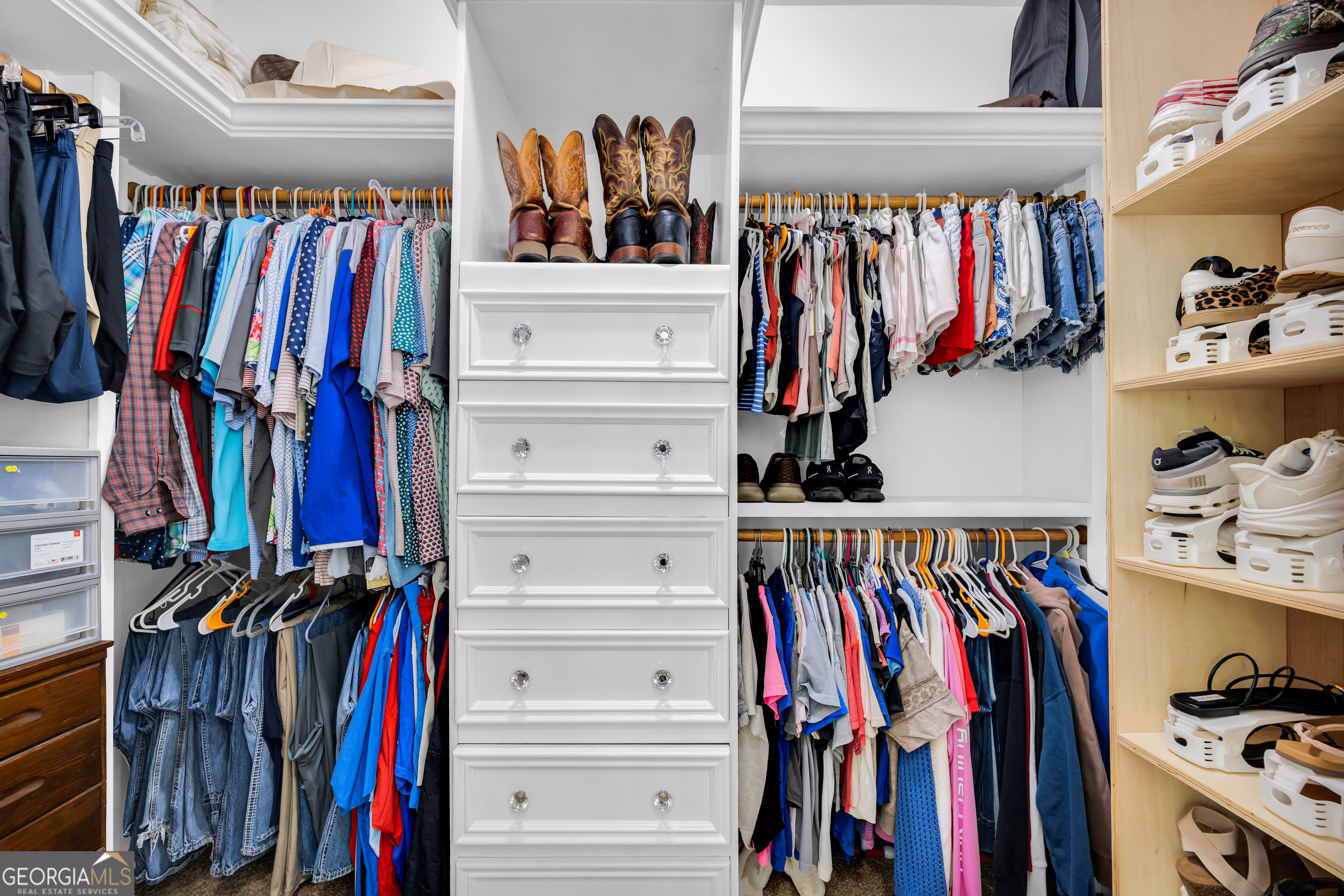 533 Emory Chambers Road Lula, GA 30554 - Photo 46 of 88 a view of walk in closet with clothes and shoes