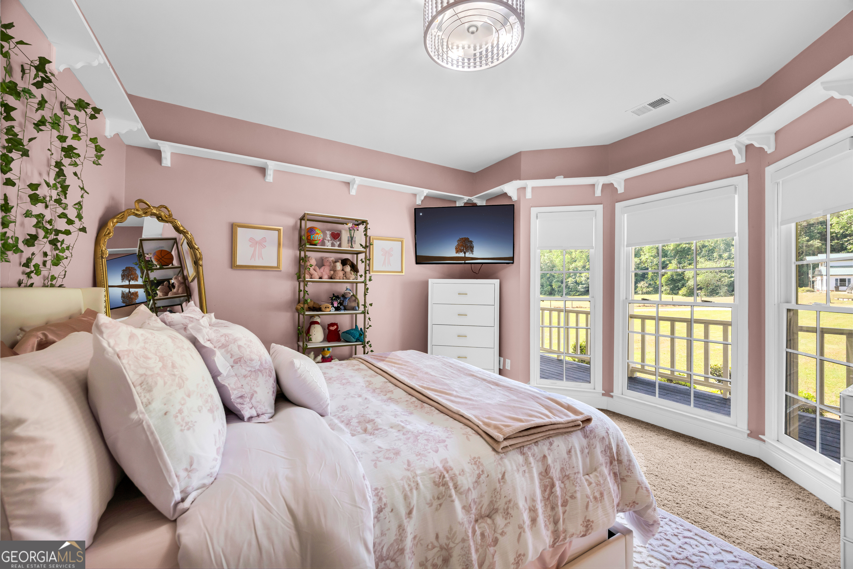 533 Emory Chambers Road Lula, GA 30554 - Photo 48 of 88 a bedroom with a large bed and a large window