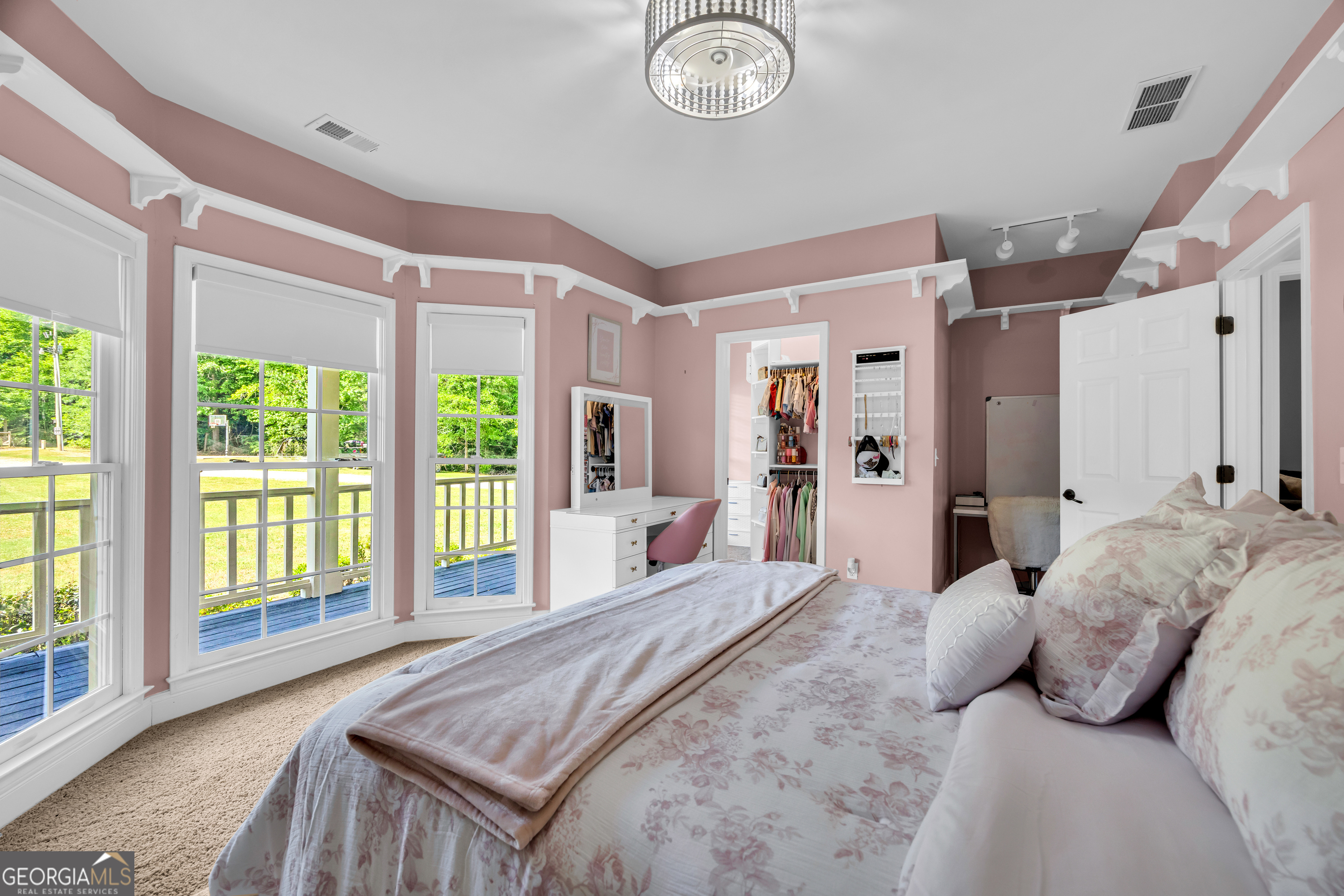 533 Emory Chambers Road Lula, GA 30554 - Photo 49 of 88 a bedroom with a large bed and a large window
