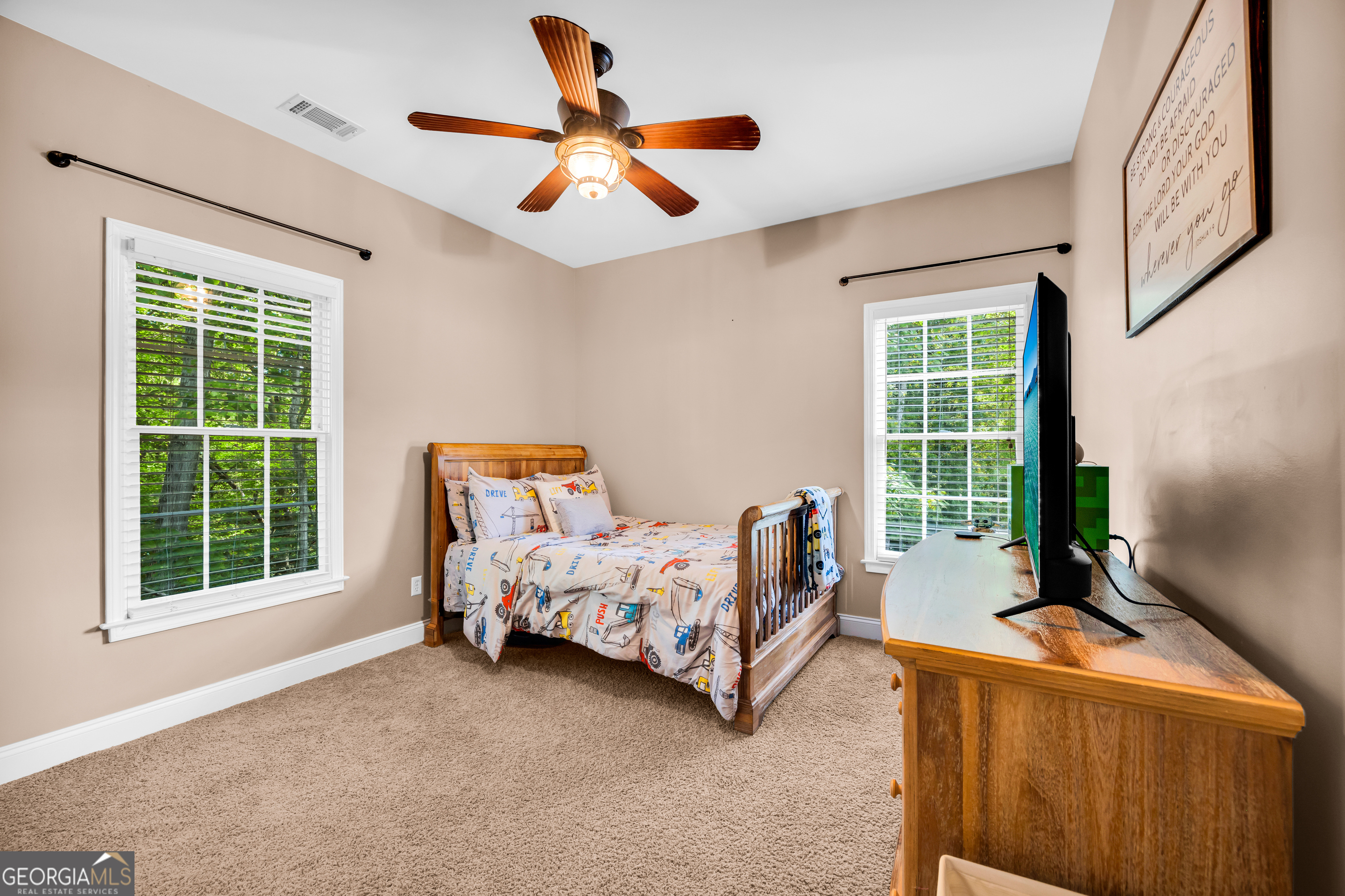 533 Emory Chambers Road Lula, GA 30554 - Photo 55 of 88 a bed room with a bed and a large window