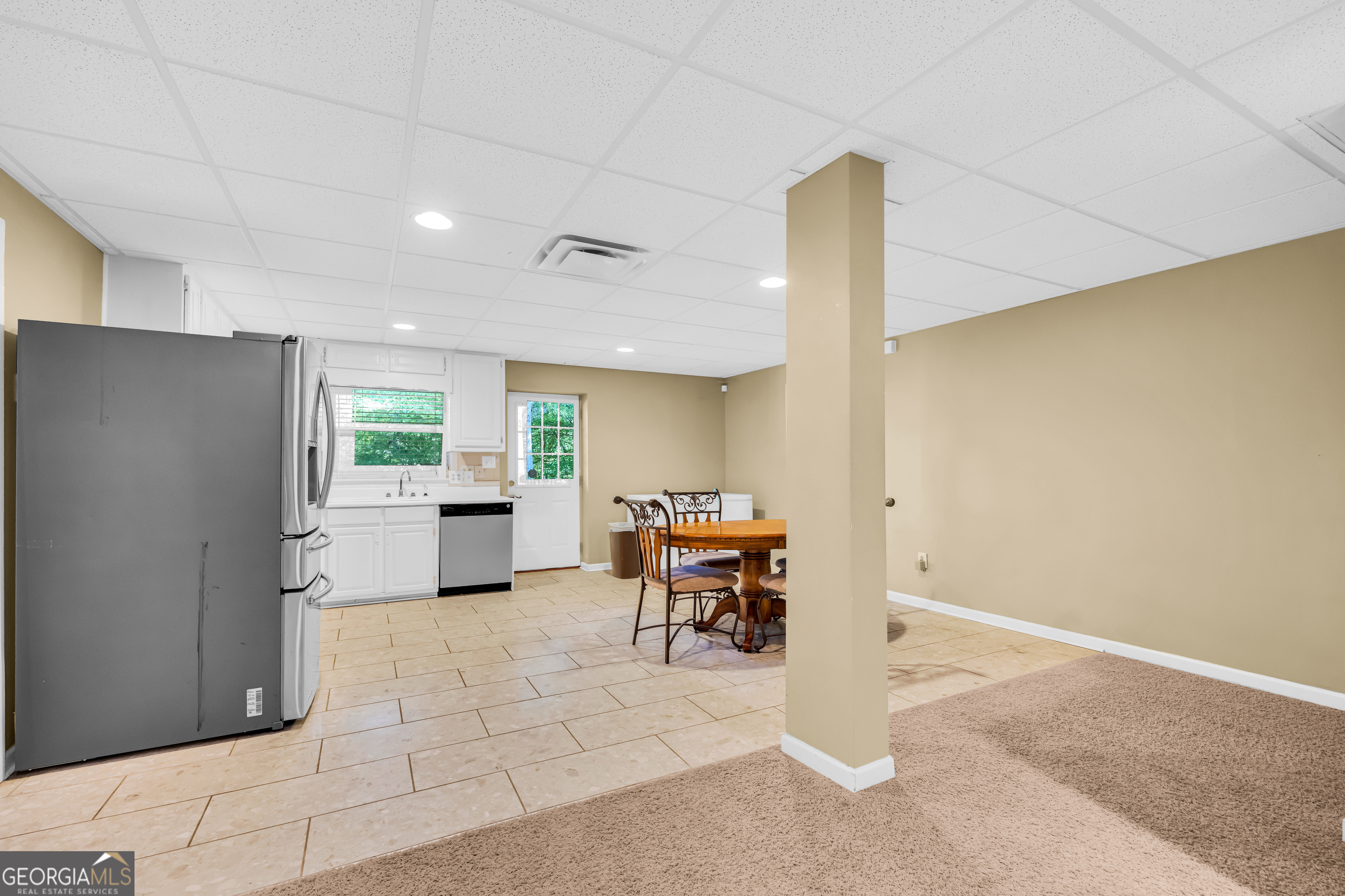 533 Emory Chambers Road Lula, GA 30554 - Photo 62 of 88 a view of a kitchen with furniture and a refrigerator