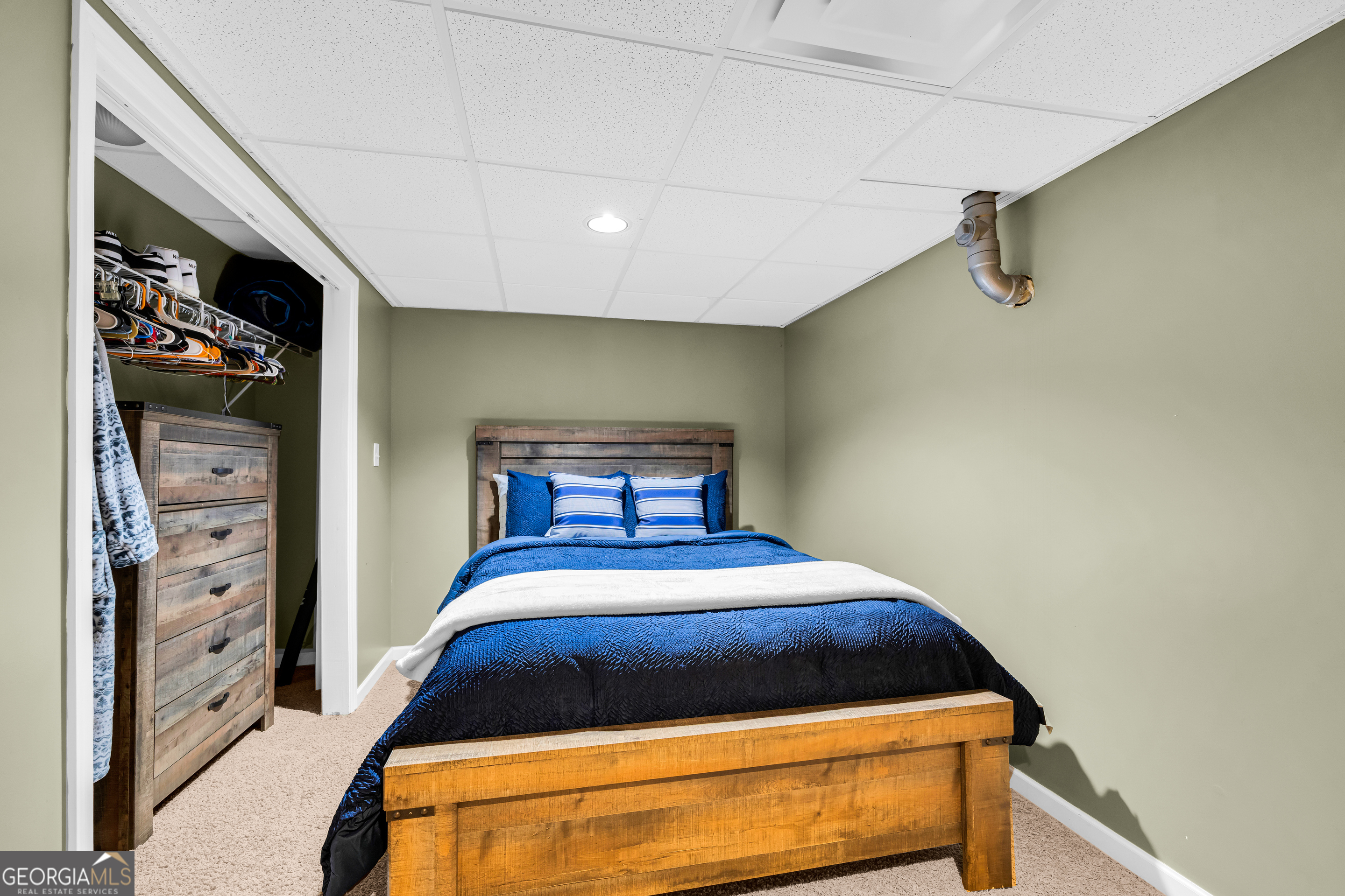 533 Emory Chambers Road Lula, GA 30554 - Photo 69 of 88 a bedroom with a bed and cabinets