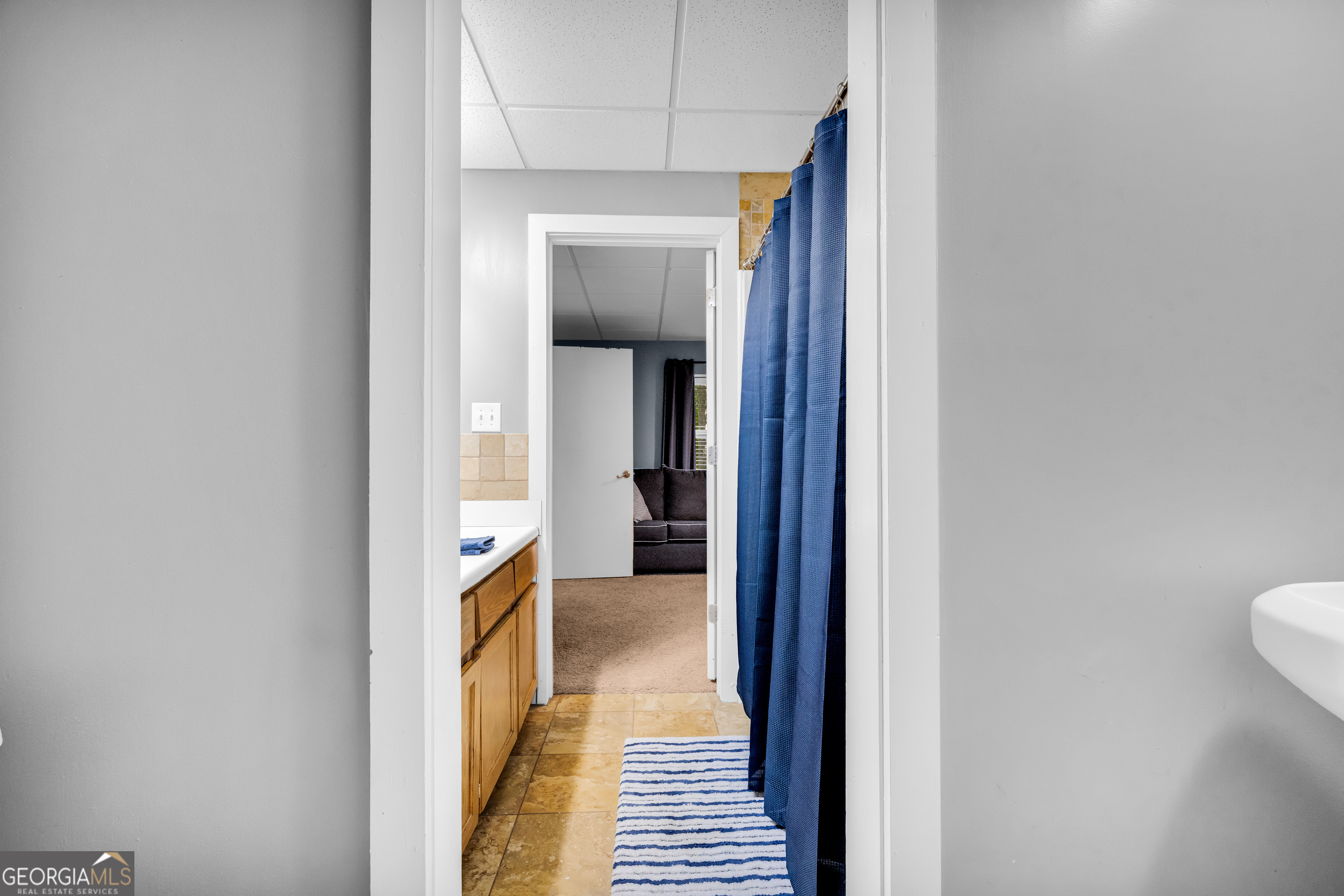 533 Emory Chambers Road Lula, GA 30554 - Photo 72 of 88 a view of a hallway with wooden floor and a bathroom