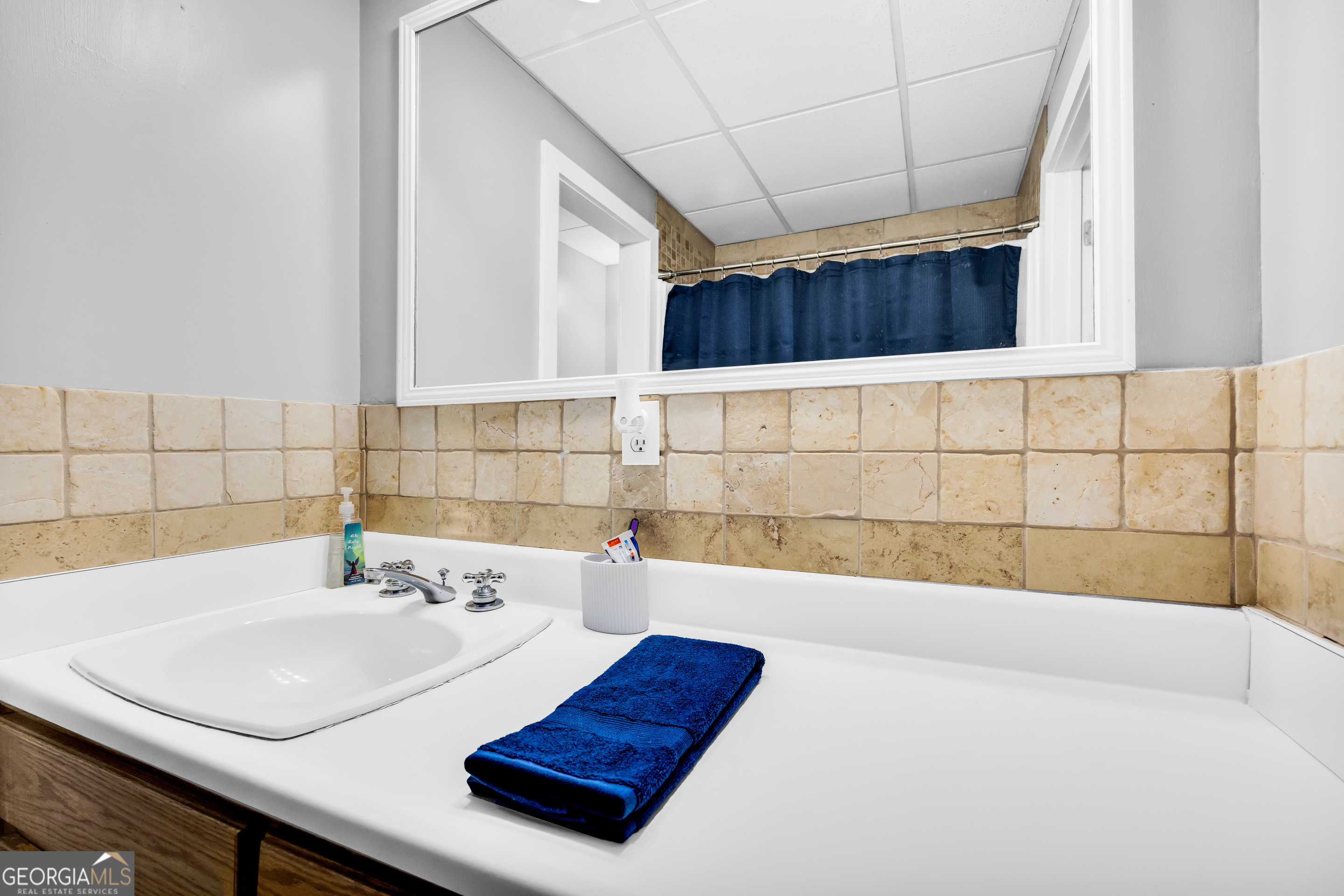 533 Emory Chambers Road Lula, GA 30554 - Photo 77 of 88 a bathroom with a sink and a bathtub