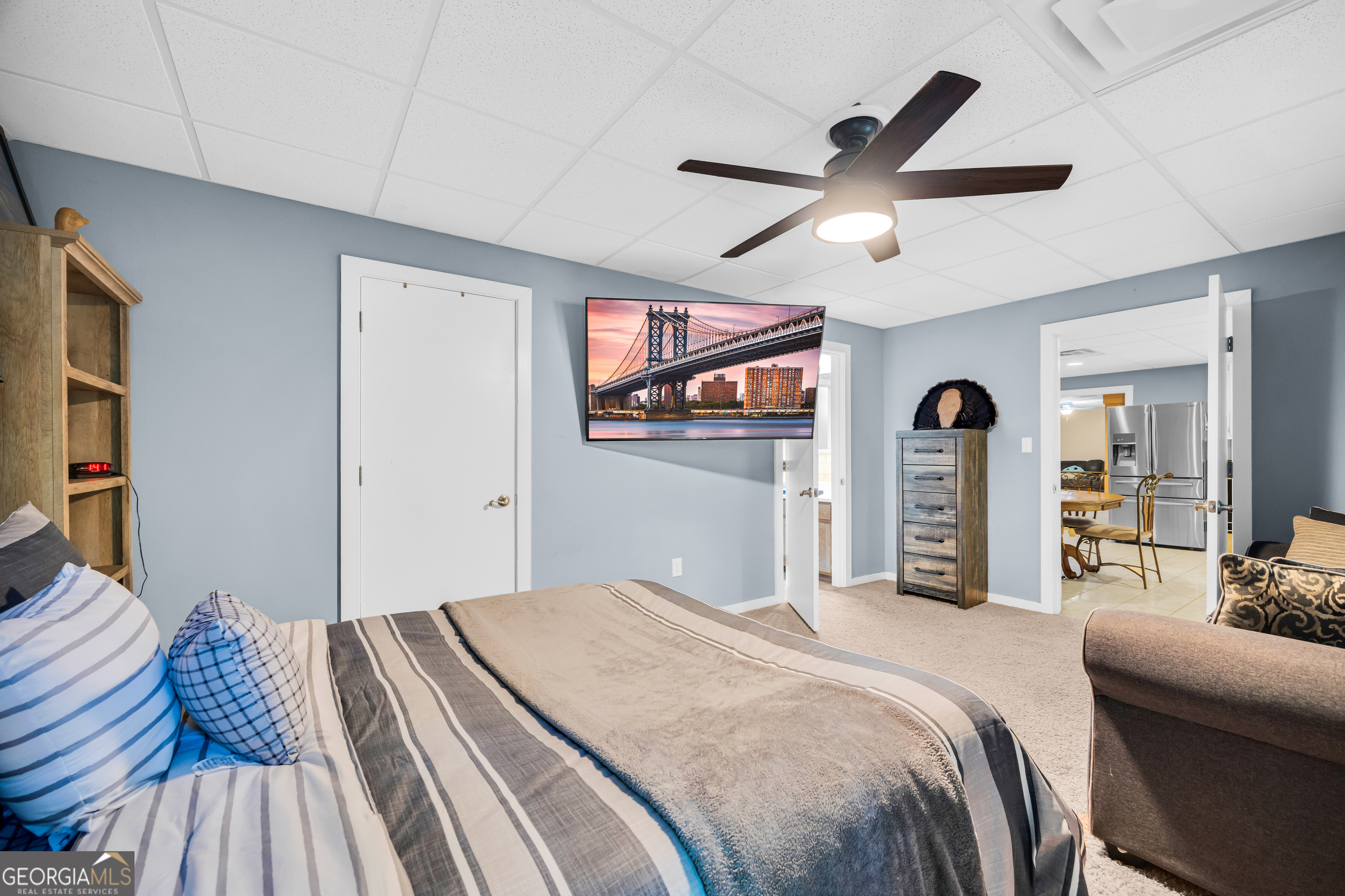 533 Emory Chambers Road Lula, GA 30554 - Photo 80 of 88 a bedroom with a bed and a chandelier