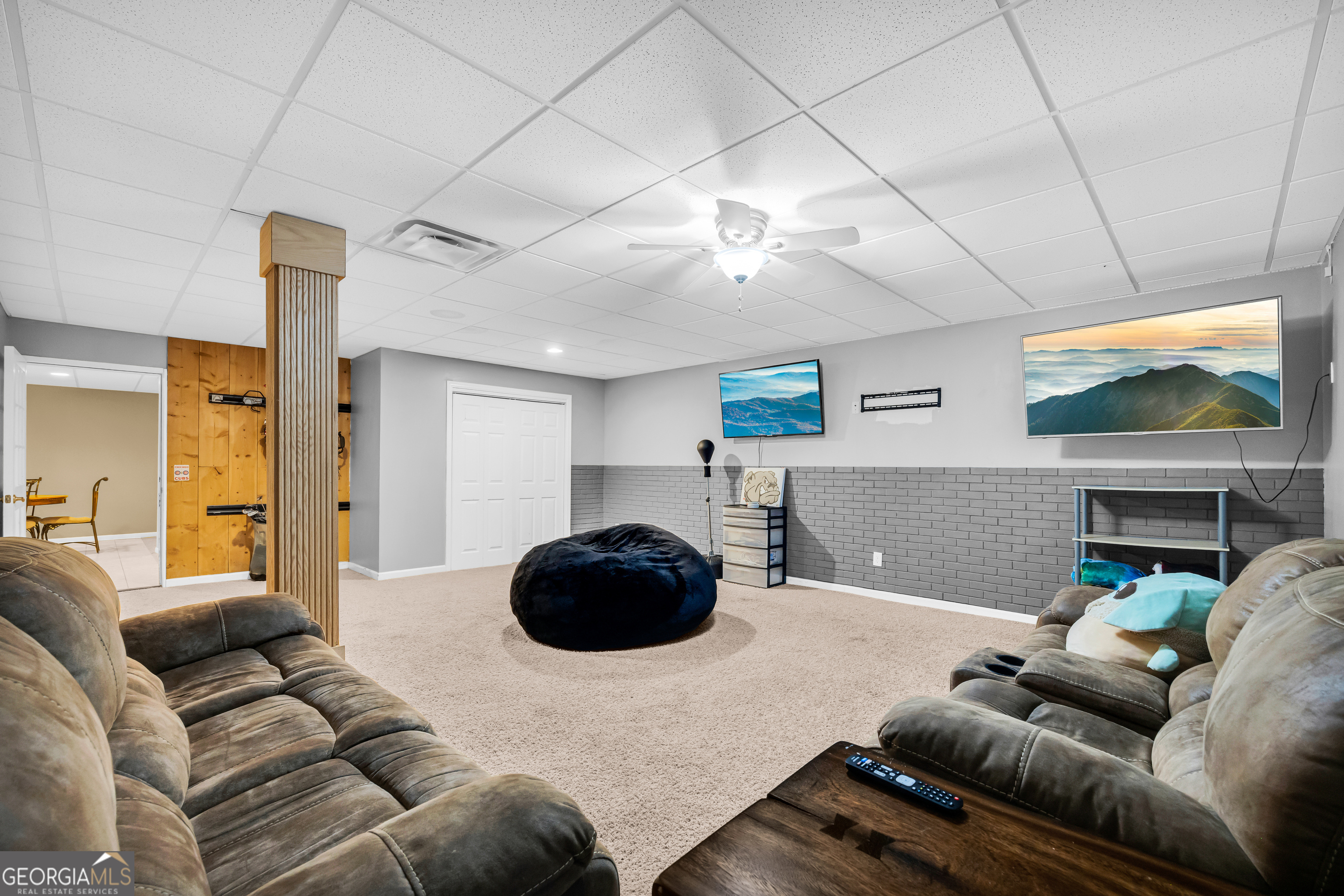 533 Emory Chambers Road Lula, GA 30554 - Photo 82 of 88 a living room with furniture and a flat screen tv