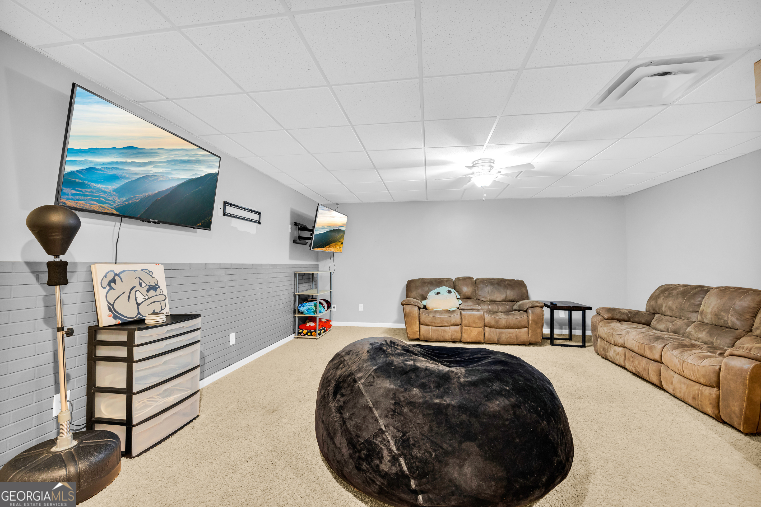 533 Emory Chambers Road Lula, GA 30554 - Photo 83 of 88 a room with furniture and a flat screen tv