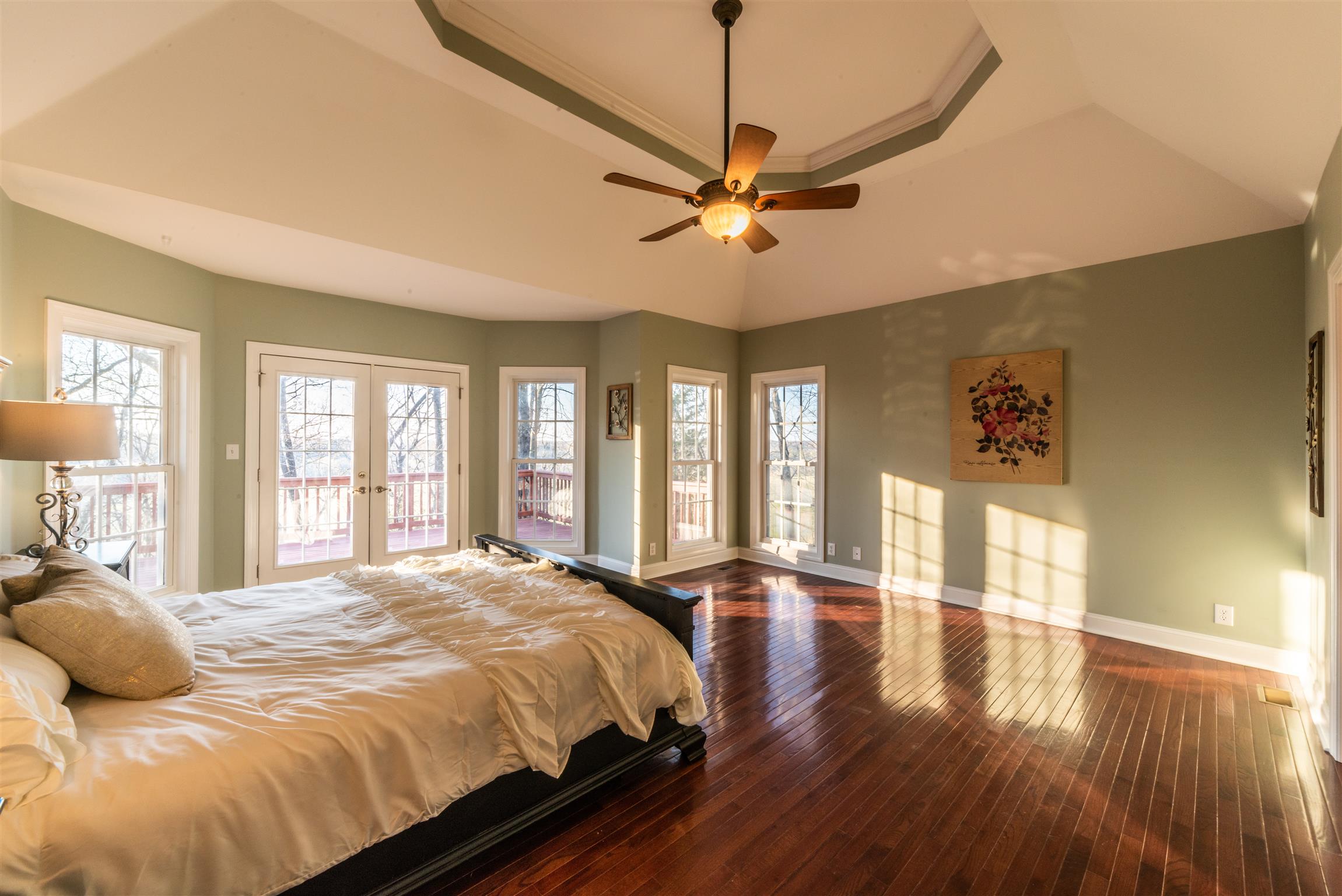 2945 Old Clarksville Springfield Road Adams, TN 37010 - Photo 13 of 30 a bedroom with a large bed and a chandelier