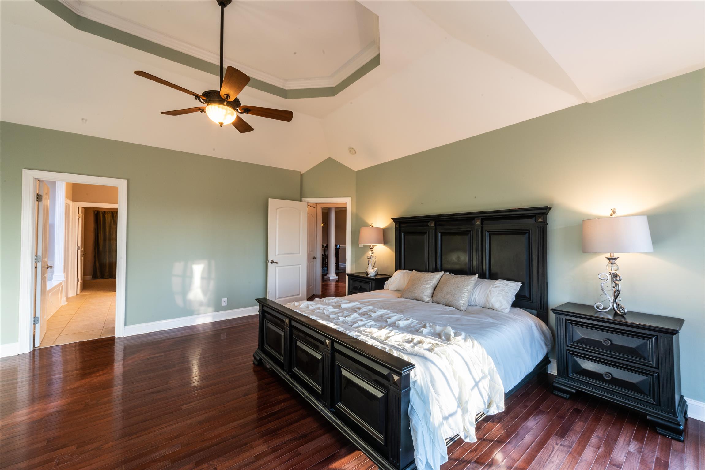 2945 Old Clarksville Springfield Road Adams, TN 37010 - Photo 14 of 30 a bedroom with a bed and wooden floor