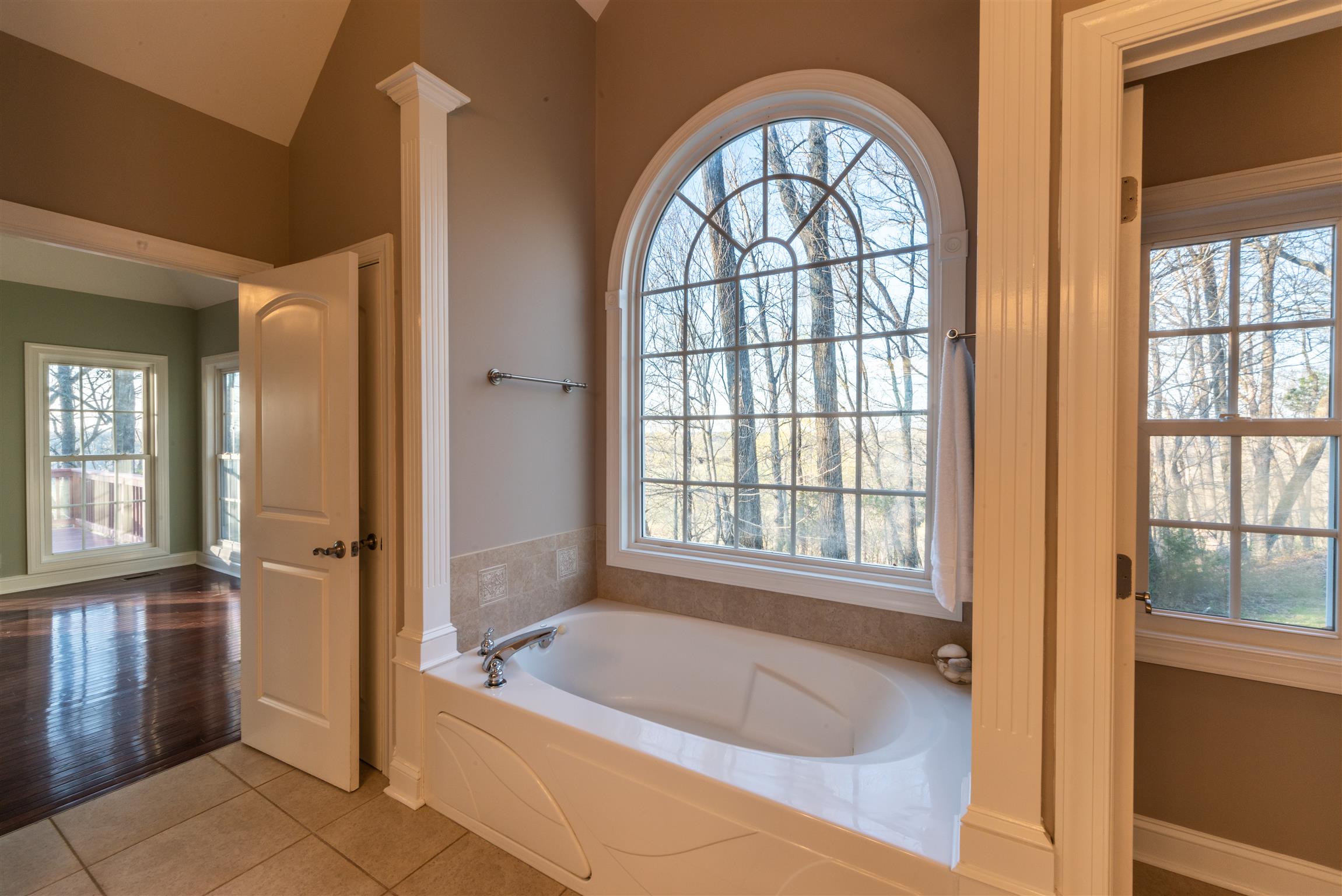 2945 Old Clarksville Springfield Road Adams, TN 37010 - Photo 16 of 30 a bathroom with a tub a sink and a window