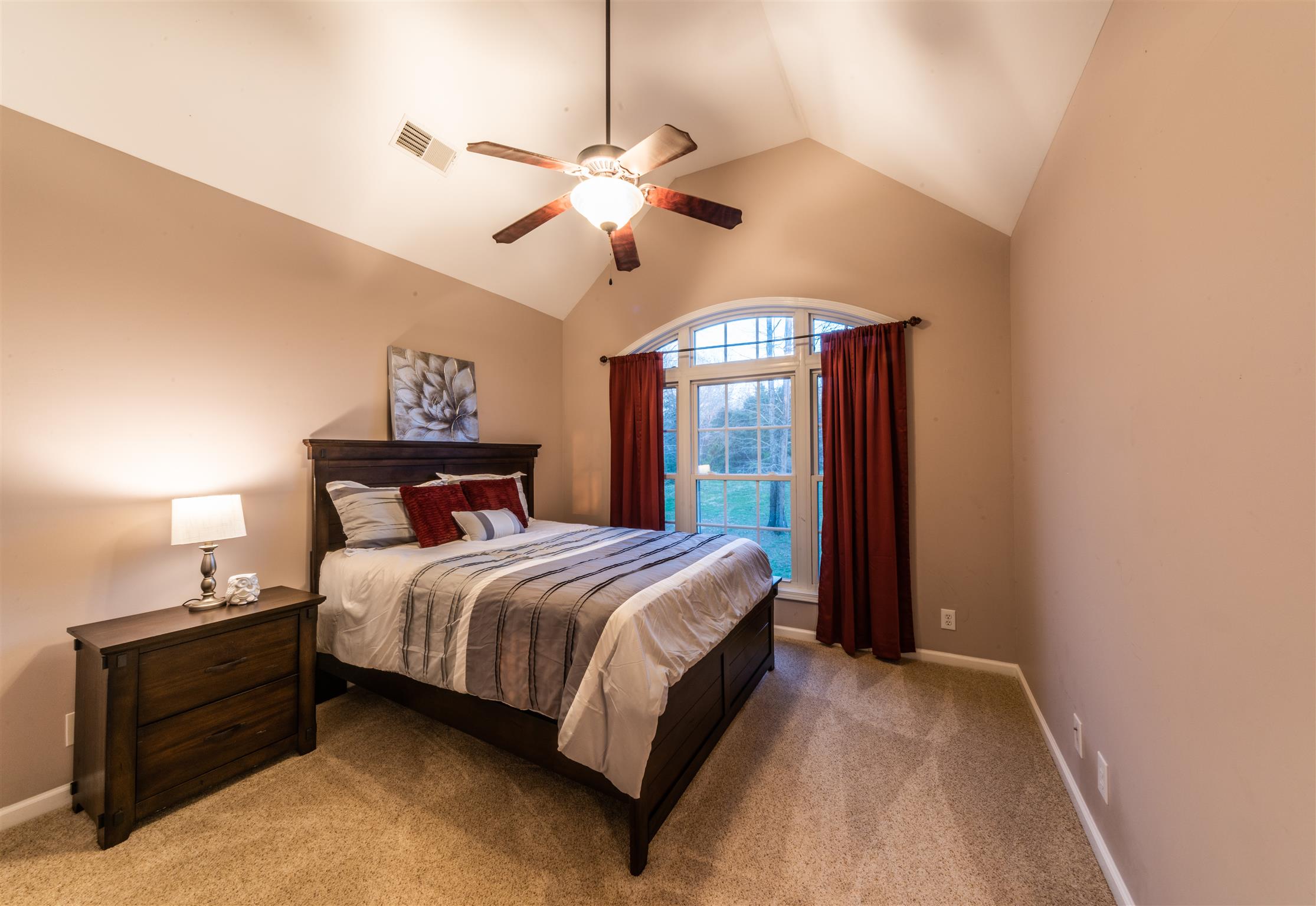2945 Old Clarksville Springfield Road Adams, TN 37010 - Photo 20 of 30 a bedroom with a bed and a chandelier