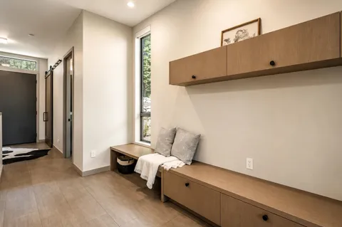 a room with a couch and a flat screen tv