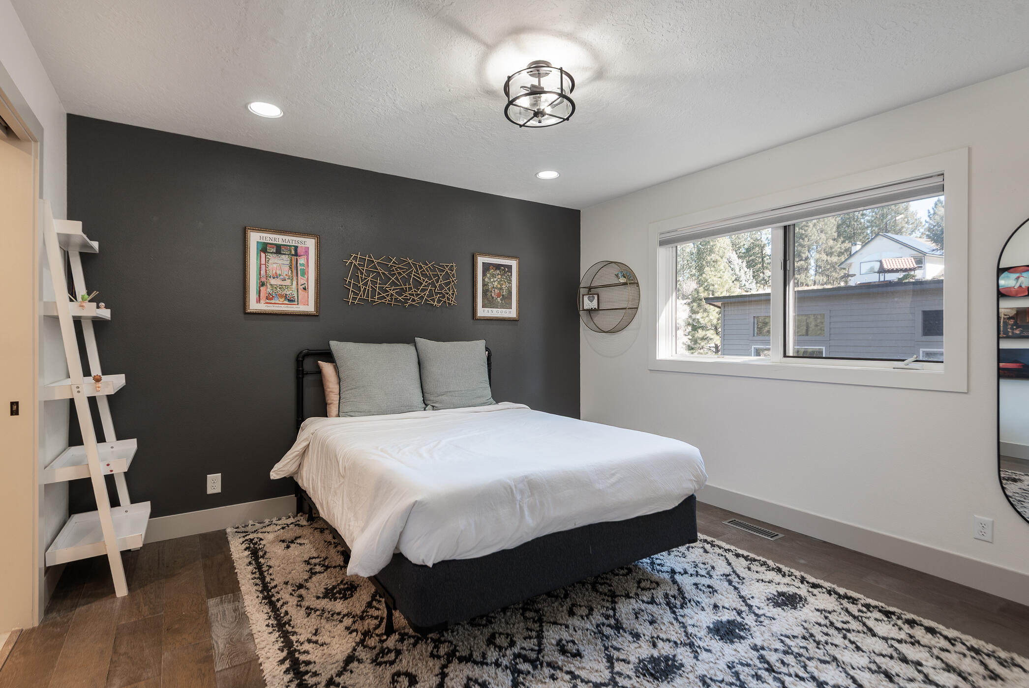 60012 West Ridgeview Drive Bend, OR 97702 - Photo 24 of 55 a bedroom with a large bed and a window